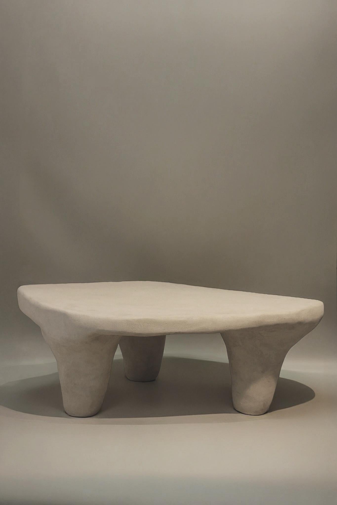 V003 Table by Aeny Studio
Limited Edition
Dimensions: D 77 x W 115 x H 39 cm.
Materials: Repurposed PVC, plywood, paper composite, gypsum mix, and sand.

Each piece is individually hand-sculpted, resulting in variations that make every item truly