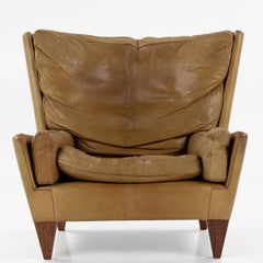 V11 - Lounge chair w. stool in buffalo leather by Illum Wikkelsø