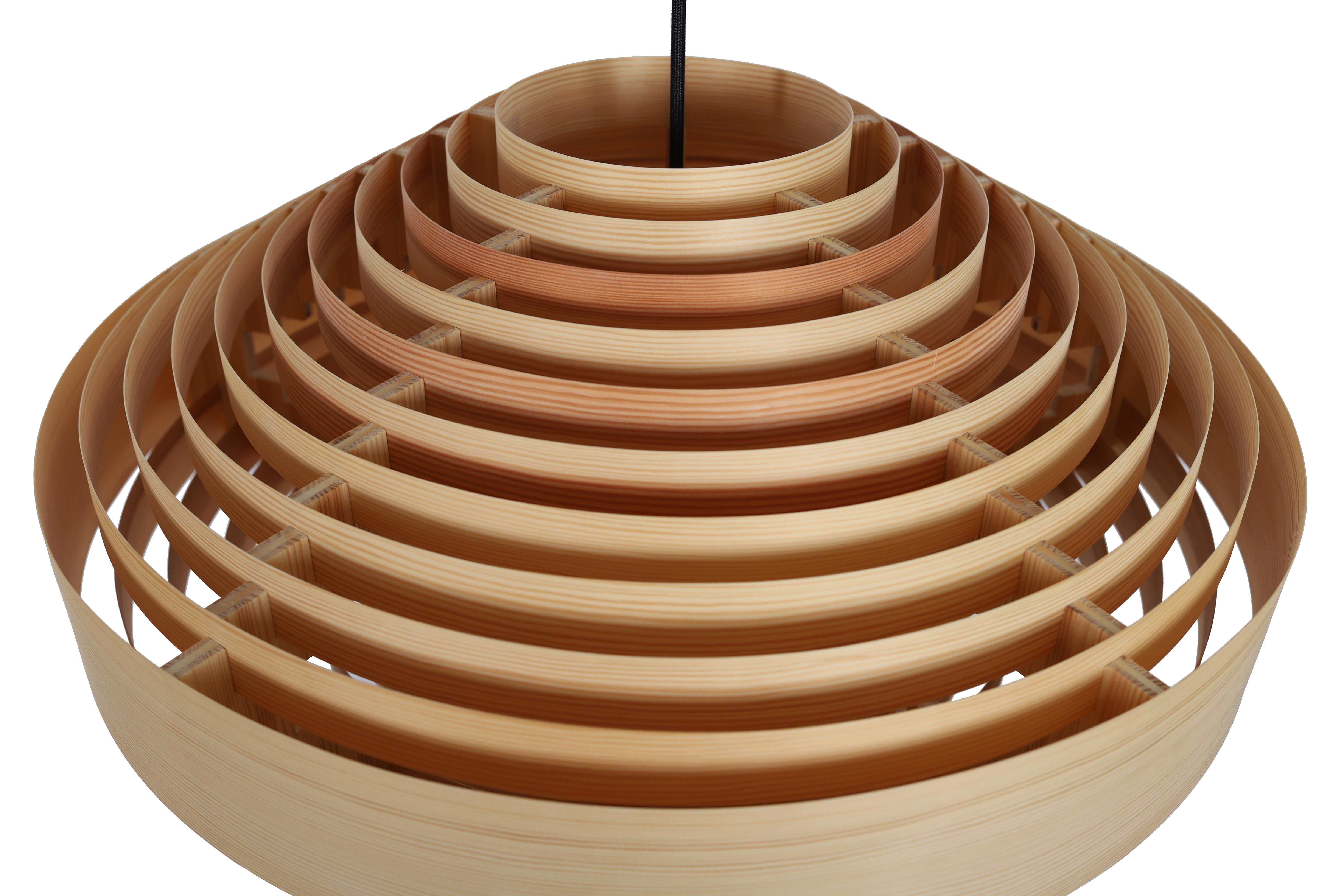 The warm glow of light filtering through pine veneer combined with an unexpectedly graphic and elemental form is the enduring appeal of these iconic Scandinavian lighting designs by Hans-Agne Jakobsson.

When Vaarnii began exploring the use of pine