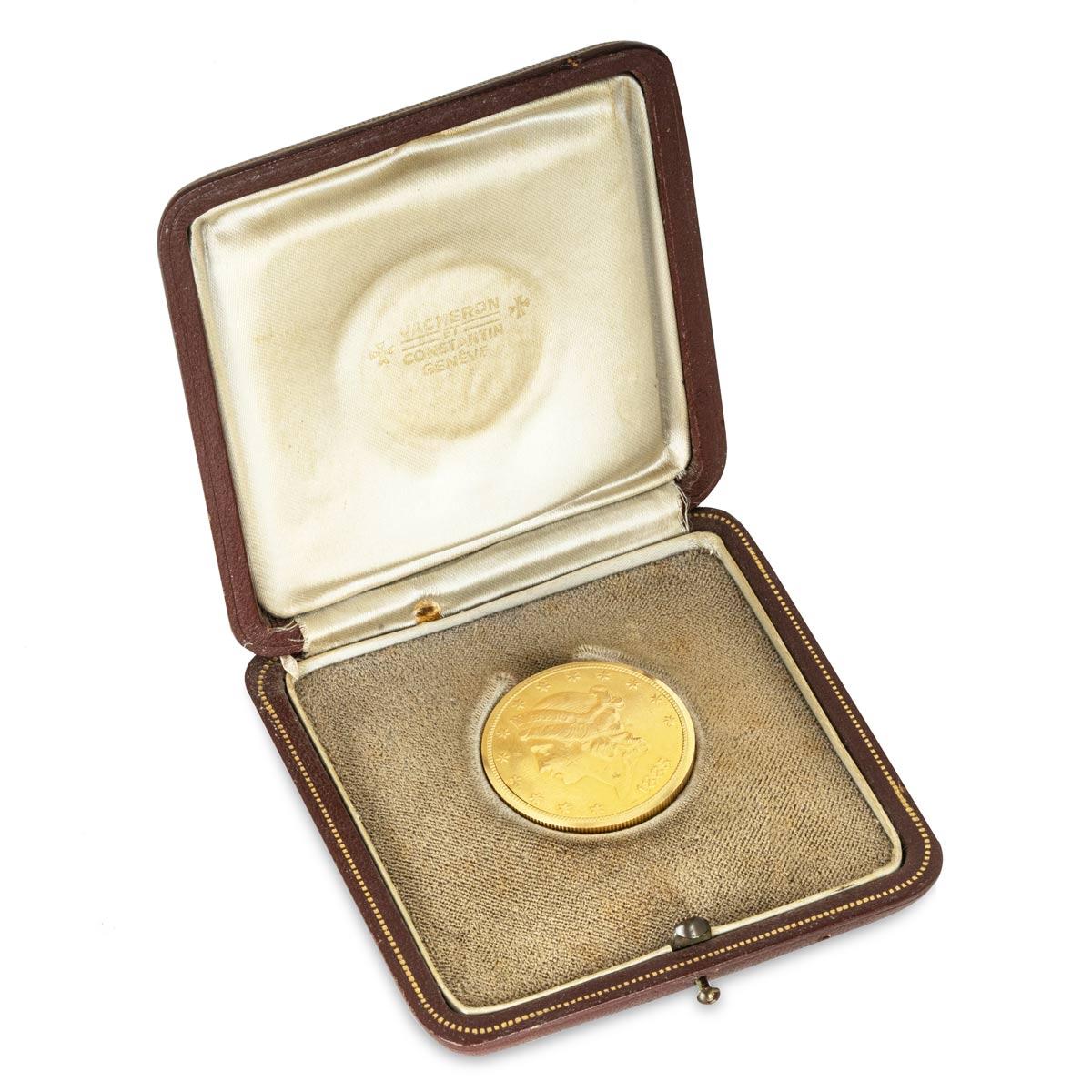 A Rare Vintage, Vacheron & Constantin Twenty Dollar Double Eagle Gold coin watch, C1960s.

Dial: The original condition plain champagne black baton dial signed Vacheron & Constantin Geneve and Swiss under the six o'clock baton.

Case: The rare