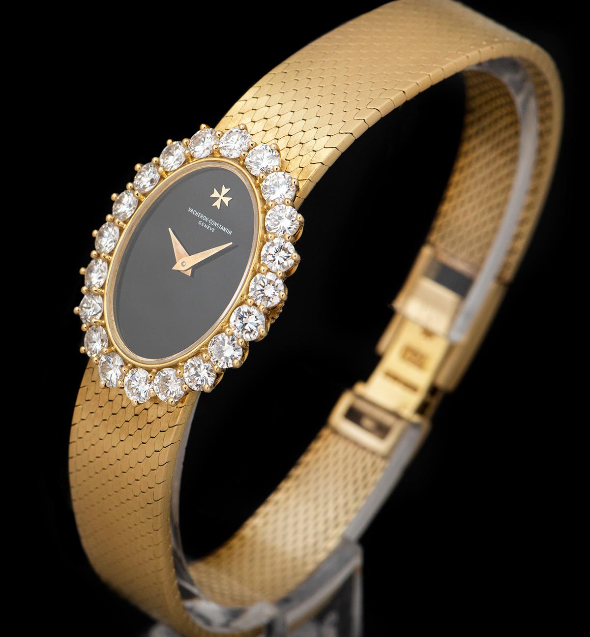 An 18k Yellow Gold Ladies Dress Wristwatch, black onyx dial, a fixed 18k yellow gold bezel set with 20 round brilliant cut diamonds (~2.06ct), an 18k yellow gold integrated bracelet with an 18k yellow gold jewellery style clasp, sapphire glass,