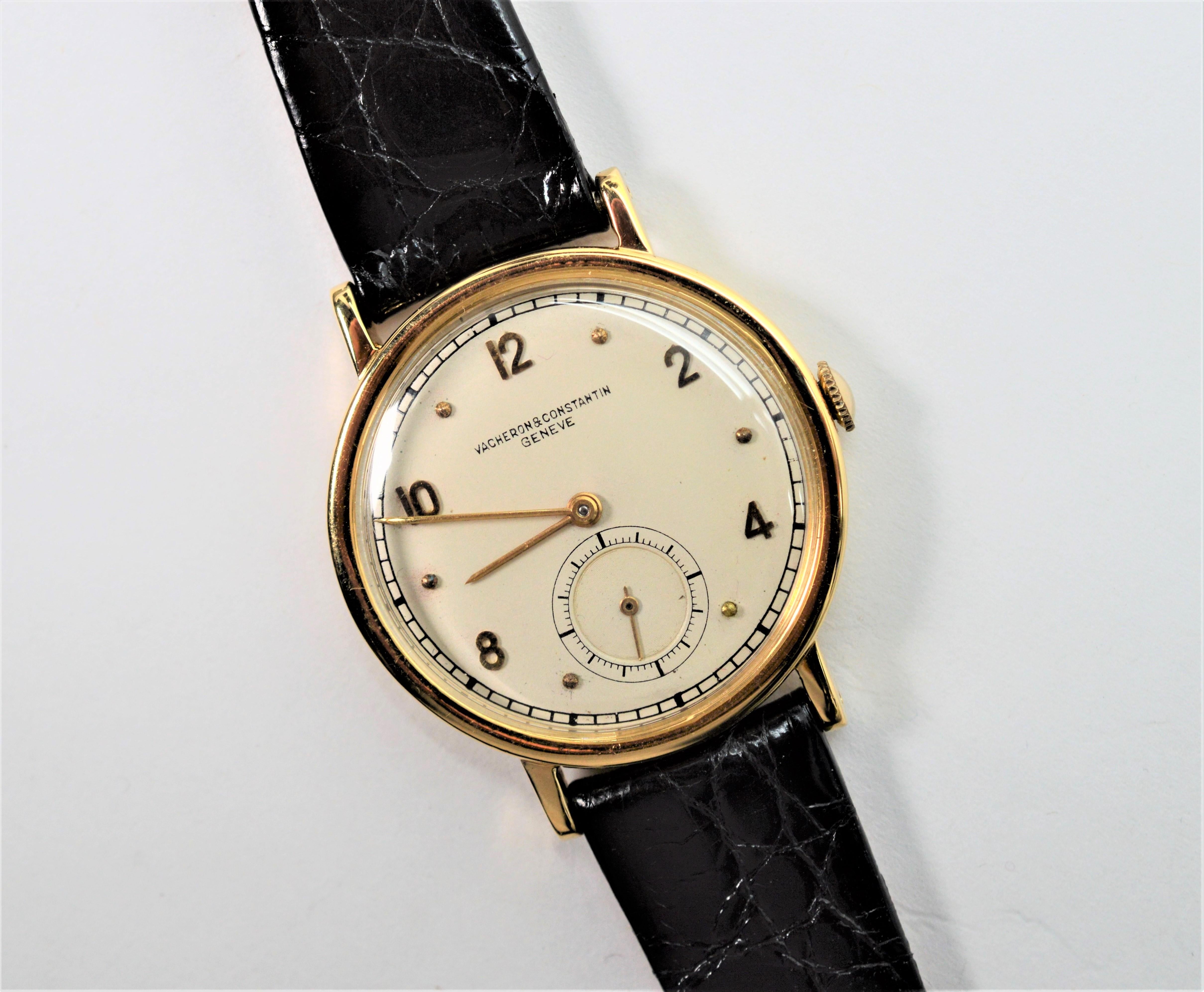 Fabulous late 1940's Men's Vacheron & Constantin Geneve eighteen karat 18K yellow gold wrist watch, number 453-3B. Classic slender styling, easy to read white face, gold Arabic numerals and gold dot markers. The watch case size is 33mm and is fitted