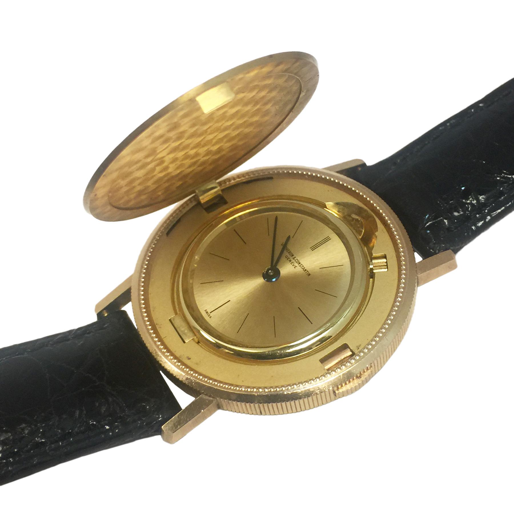 From the Estate of Comedian Jerry Lewis is this circa 1970 Vacheron Constantin $20 U. S. Gold Coin wrist watch. 34 MM 18K Yellow Gold case with a coin edge and a partial concealed button to operate the flip open cover. 17 jewel mechanical, manual
