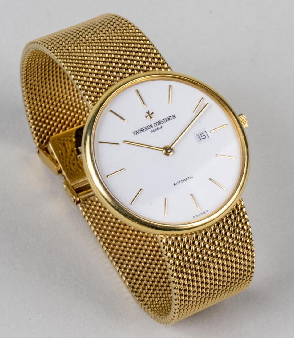 Serial number 590481, white dial with baton hours and date aperture, automatic movement, 18k yellow gold mesh band.  Length 7 inches.