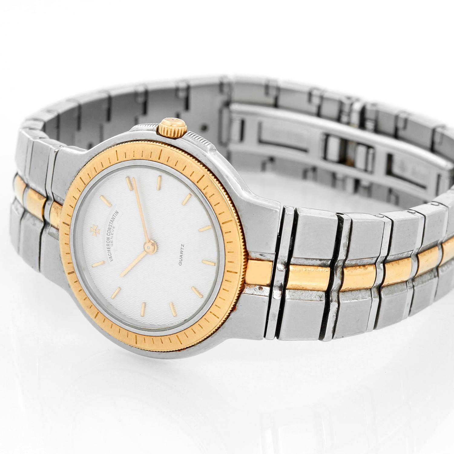 Vacheron Constantin Ladies Phidias Watch  - Quartz. 18K Yellow gold and stainless steel (28 mm). Textured ivory dial with gold stick hour markers. Two-tone link bracelet; will fit a 6 1/2 bracelet . Pre-owned with Vacheron box and papers