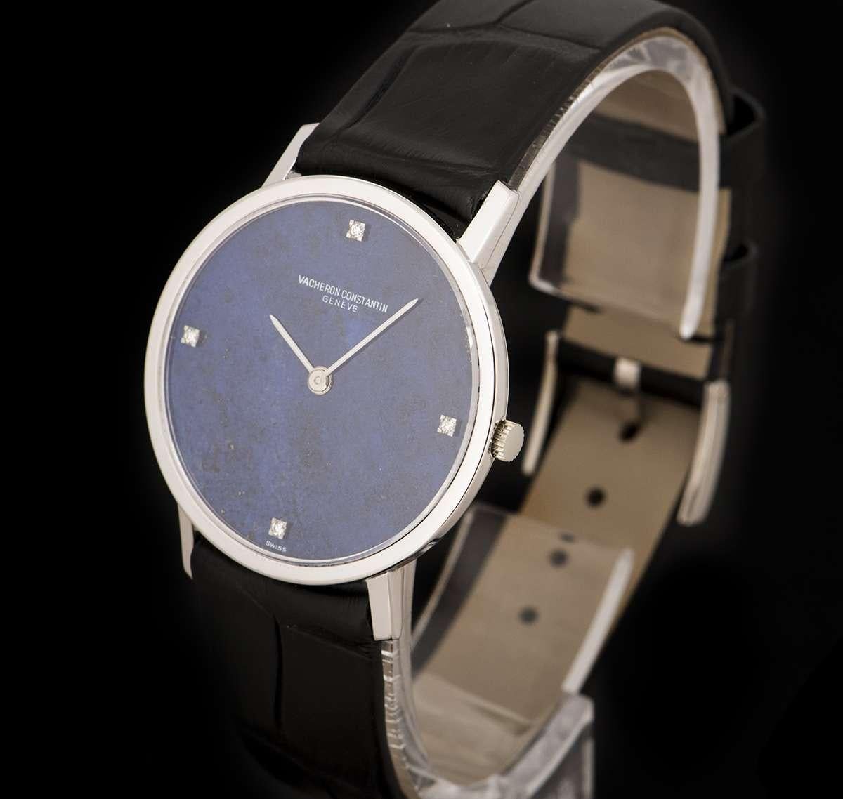 An 18k White Gold Mid-Size Dress Wristwatch, lapis lazuli dial set with 4 round brilliant cut diamond hour markers, a fixed 18k white gold bezel, a brand new original black leather strap with an 18k white gold pin buckle, sapphire glass, manual wind