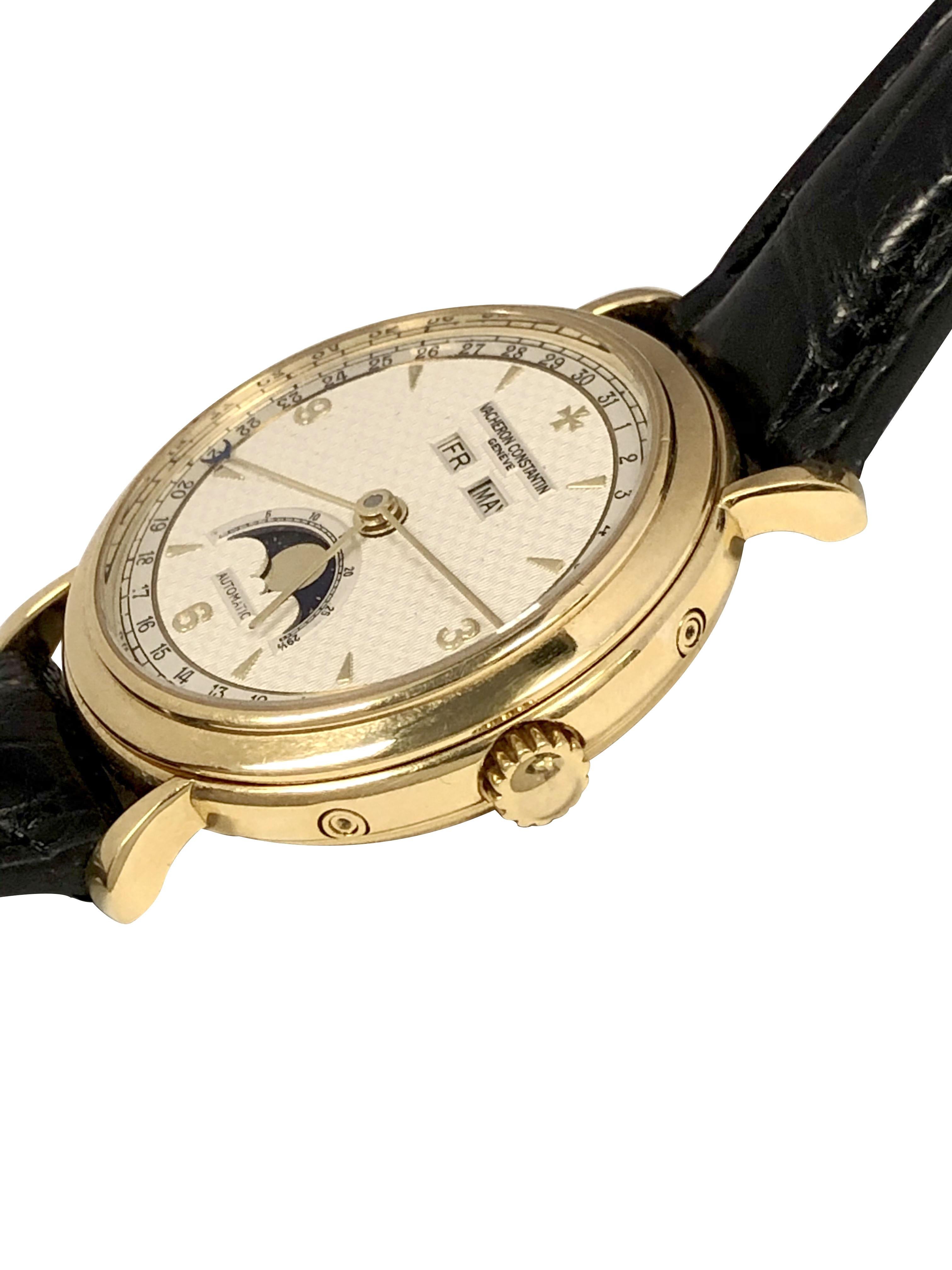 Circa 2000 Vacheron Constantin Wrist Watch, REF 47050,  36 mm, 18k Yellow Gold 3 piece case that is 10 MM in thickness. Automatic, Self winding movement, Silver Satin Guilloche Textured Dial with Raised Gold Markers,  Moonphase, Day and Month