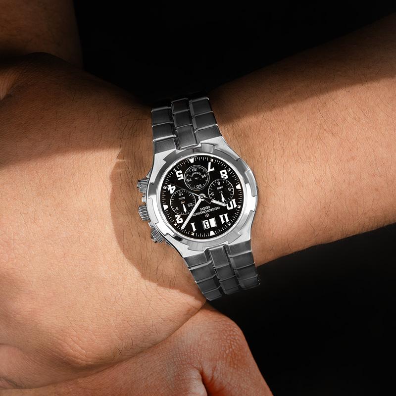 A stainless steel Overseas Chronograph wristwatch by Vacheron Constantin. Featuring a black dial with applied arabic numbers, a date aperture, 3 chronograph counters and a fixed stainless steel bezel. Fitted with a sapphire glass, an automatic