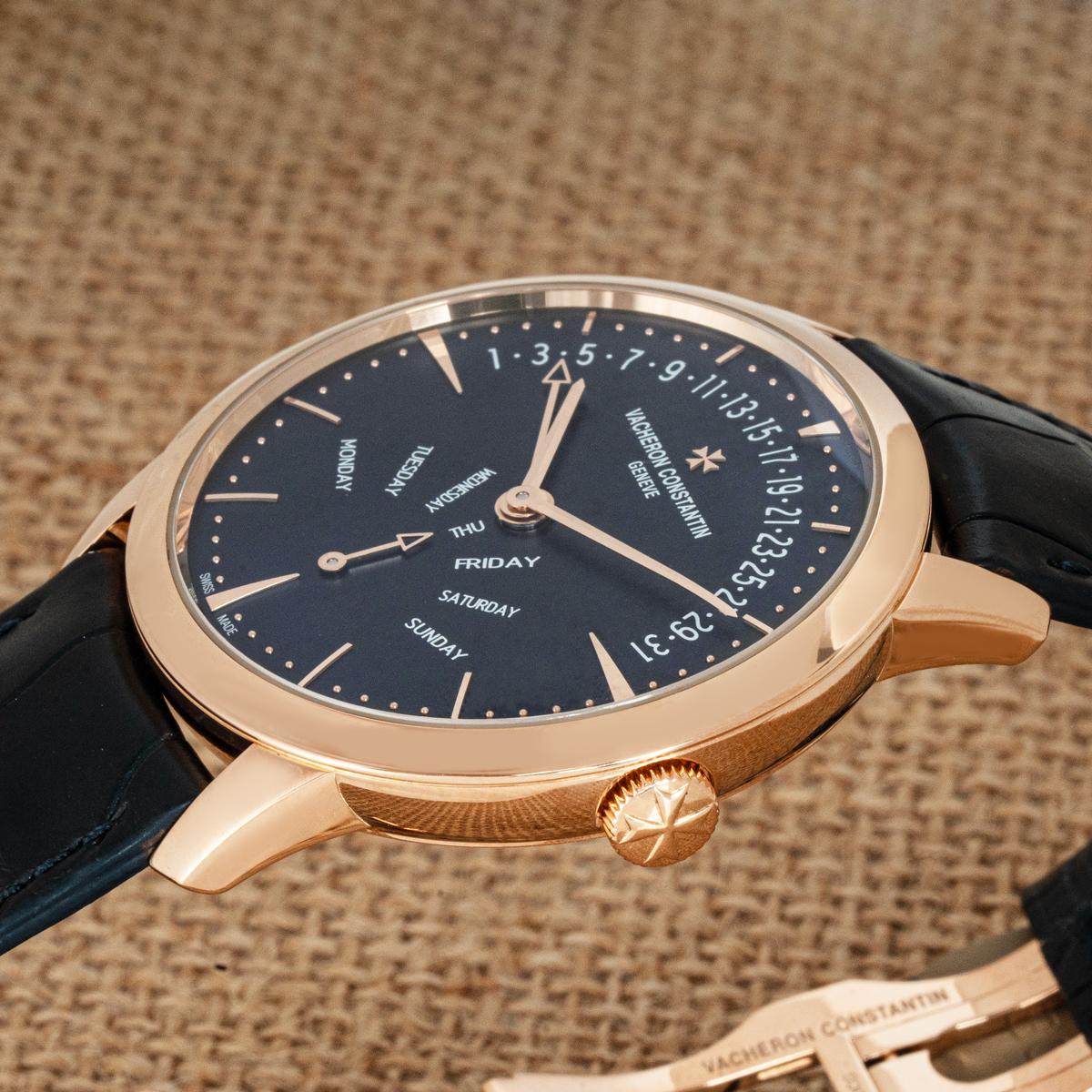 A 42mm Vacheron Constantin Patrimony Retrograde Day-Date in rose gold. Features a distinct sunburst blue dial with a retrograde hand, and a day and date display. Fitted with sapphire crystal and a self-winding automatic movement which can be admired