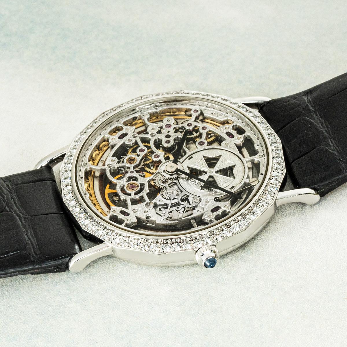 A white gold Patrimony Squelette by Vacheron Constantin from their Les Complications collection. Features a skeleton dial complemented by a diamond set white gold bezel. Fitted with sapphire crystal and a manual wind movement which can be seen via