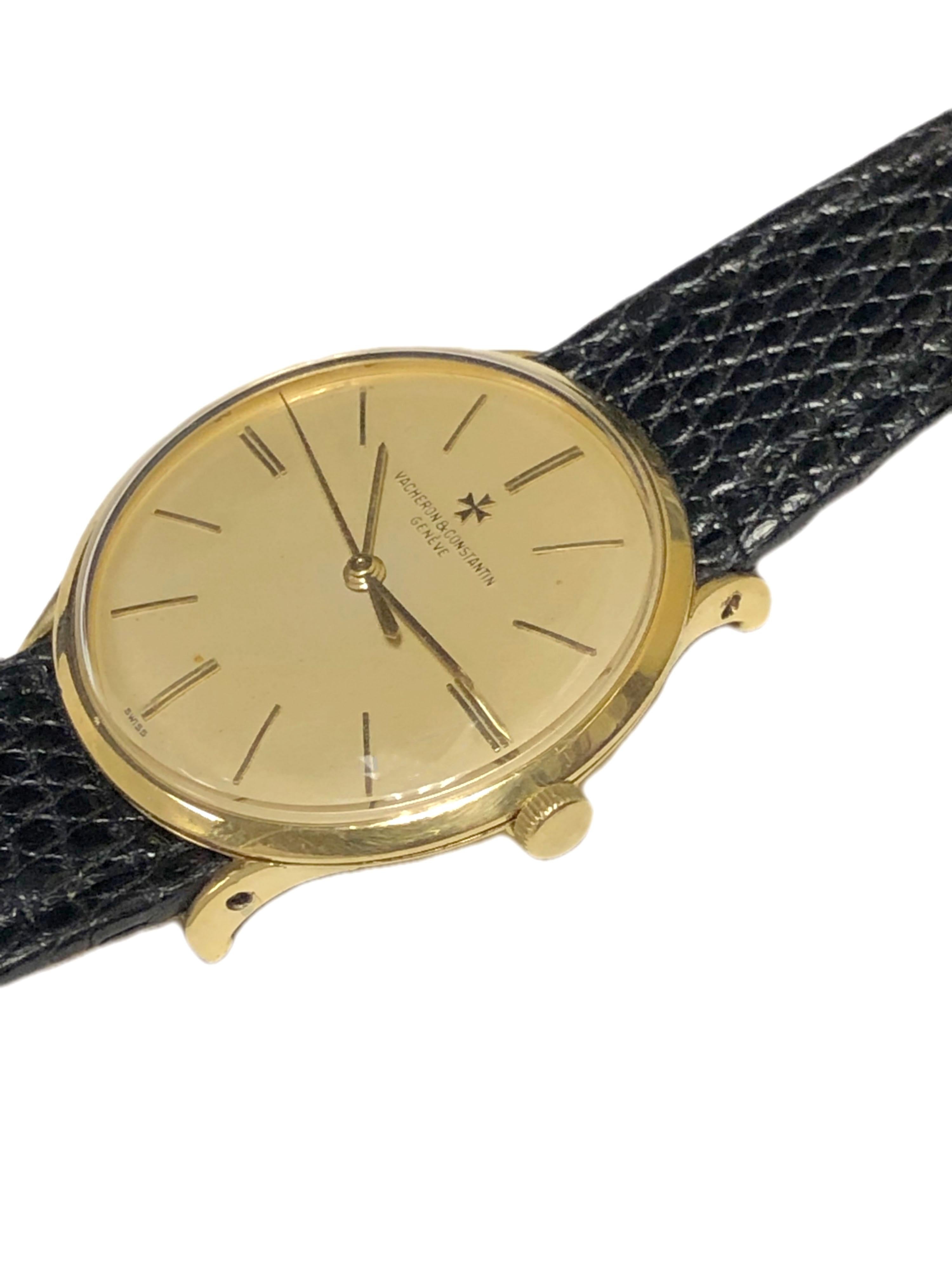 Circa 1960 Vacheron & Constantin Wrist Watch, 18K Yellow Gold 31 M.M. 3 Piece Case with Curved Down lugs. 18 Jewel Mechanical, Manual wind nickle lever movement. Original Gold Satin Dial with Raised Gold markers and a sweep seconds hand. New Black