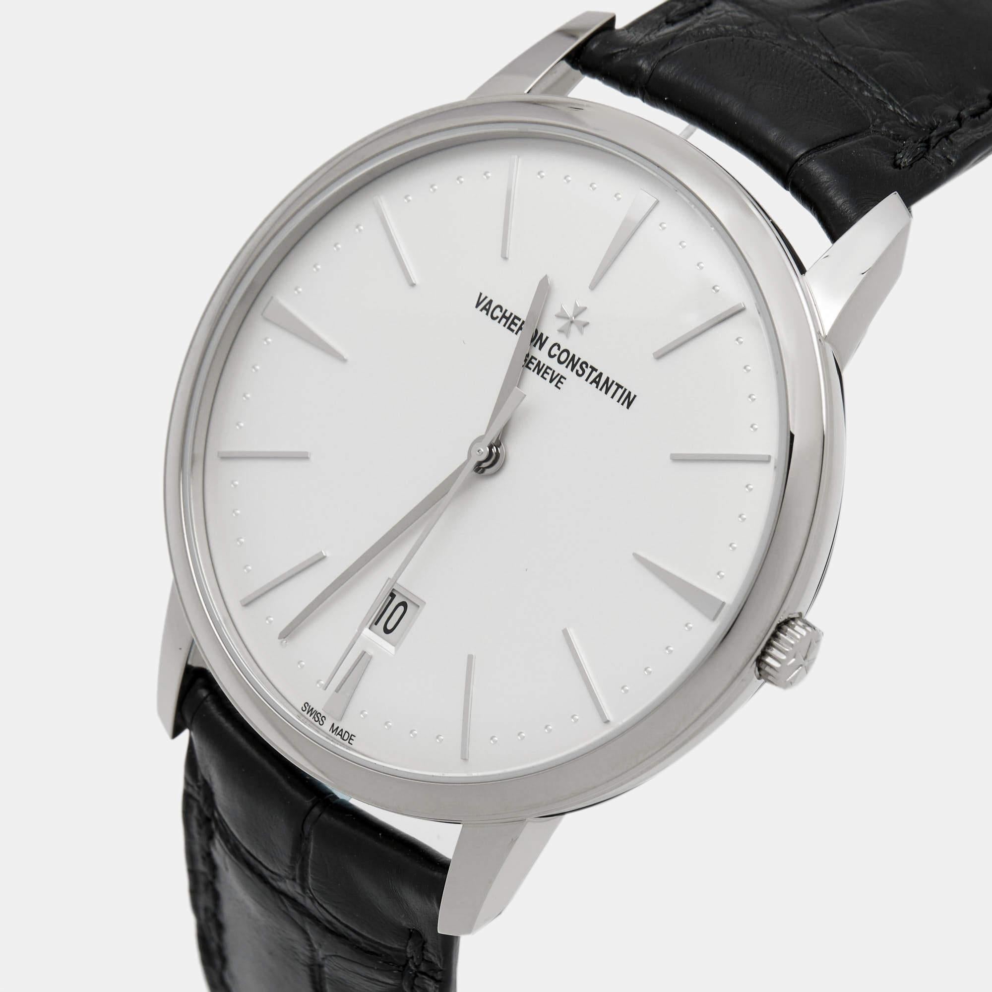 The Vacheron Constantin Patrimony 85180/000G-9230 wristwatch exudes timeless elegance with its 18K white gold case. The silver dial showcases minimalist sophistication, featuring gold hour markers and sharp hands. Its alligator leather strap