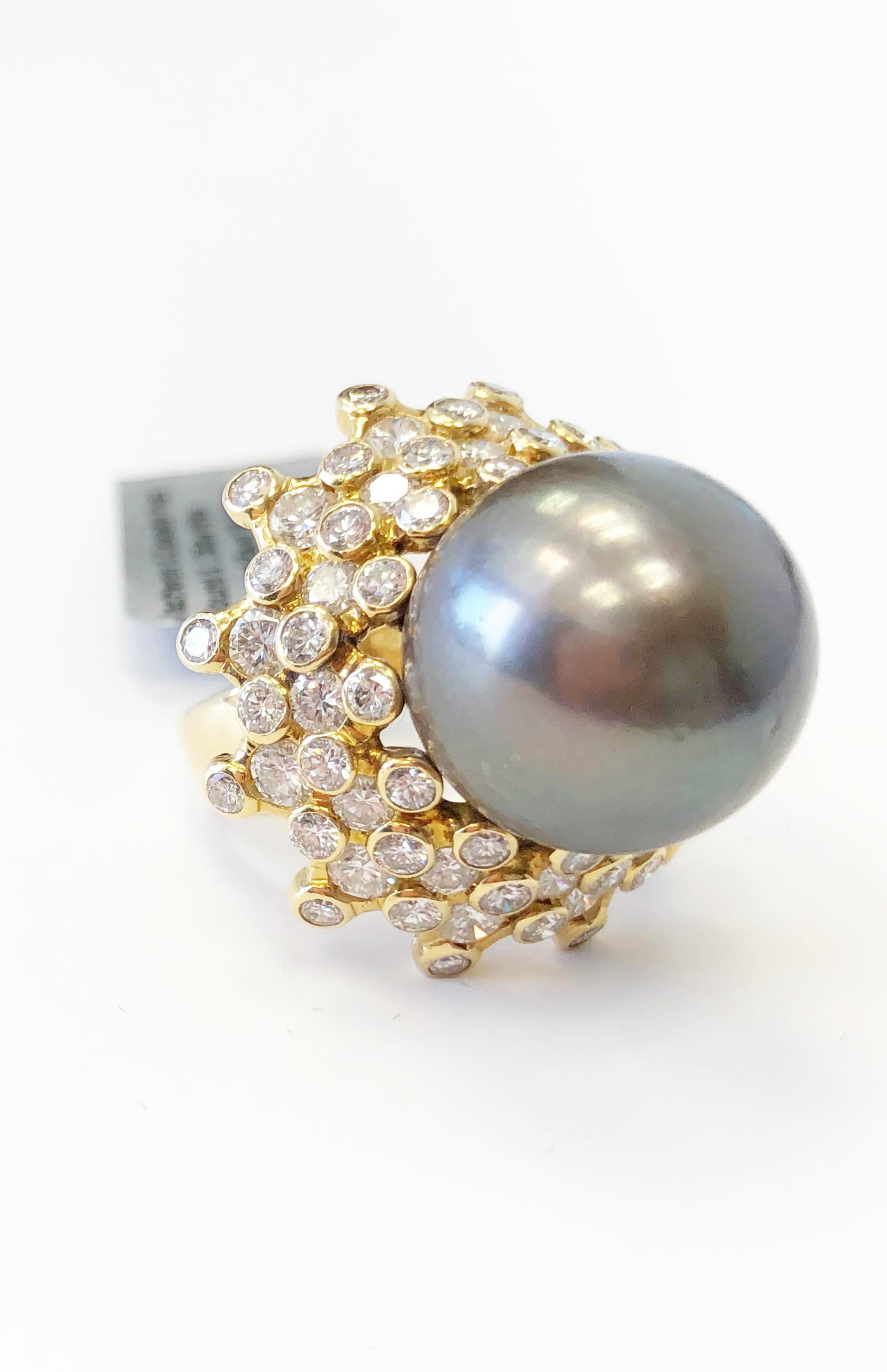 Beautiful Vacheron Constantin Tahitian pearl and diamond ring.  Good quality white diamonds weighing 2.95 carats in 18k yellow gold ring size 5.5.  This ring is perfect for any special occasion with it's classic feel and big look.


 