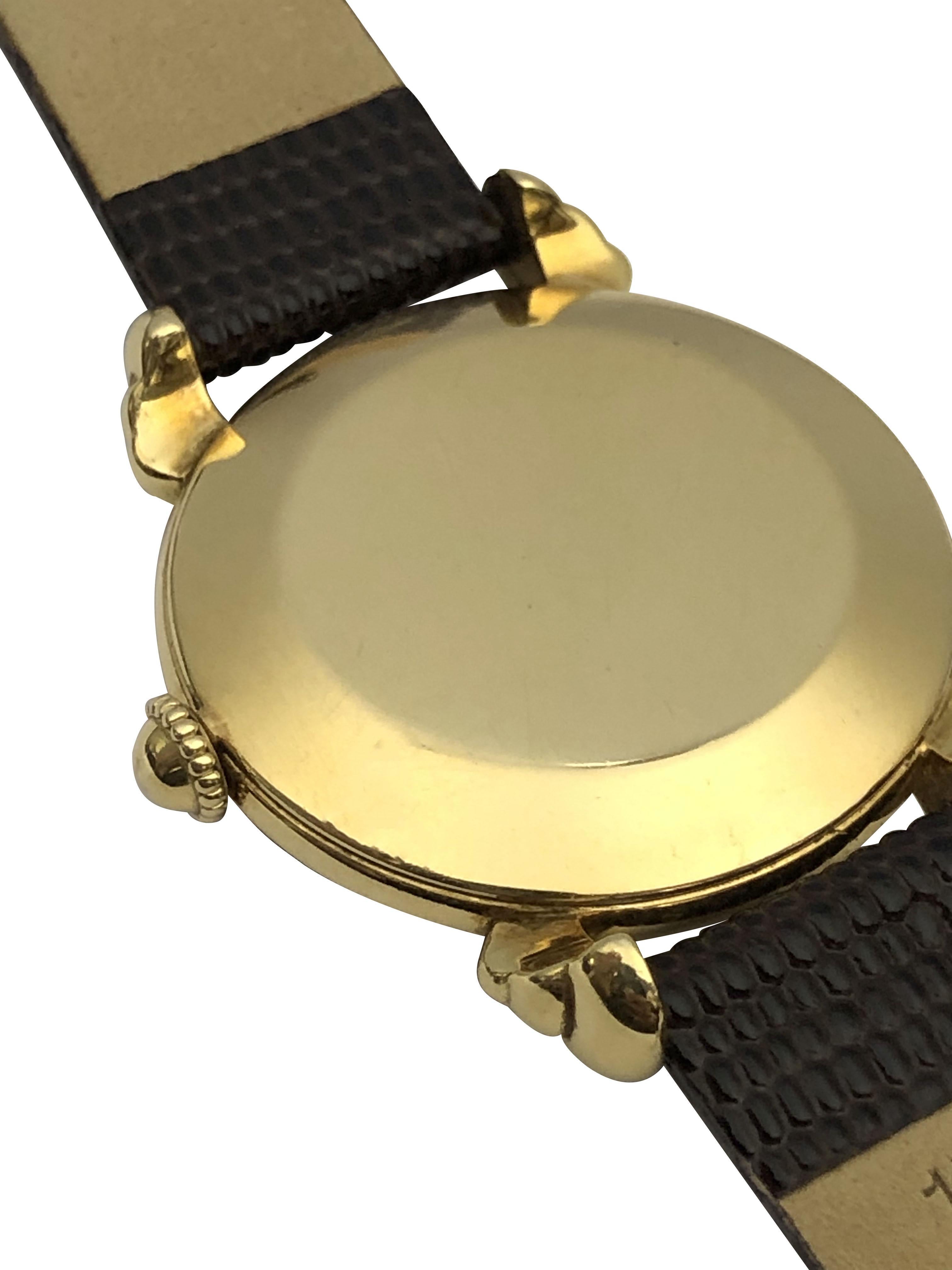 Circa 1940s Vacheron & Constantin Wrist Watch,  35 M.M. 18k Yellow Gold 2 Piece case with exaggerated scrolled lugs. 17 Jewel Mechanical, Manual wind Nickle lever movement. Gold satin dial with Raised Gold Markers. New Brown Lizard Grain strap.