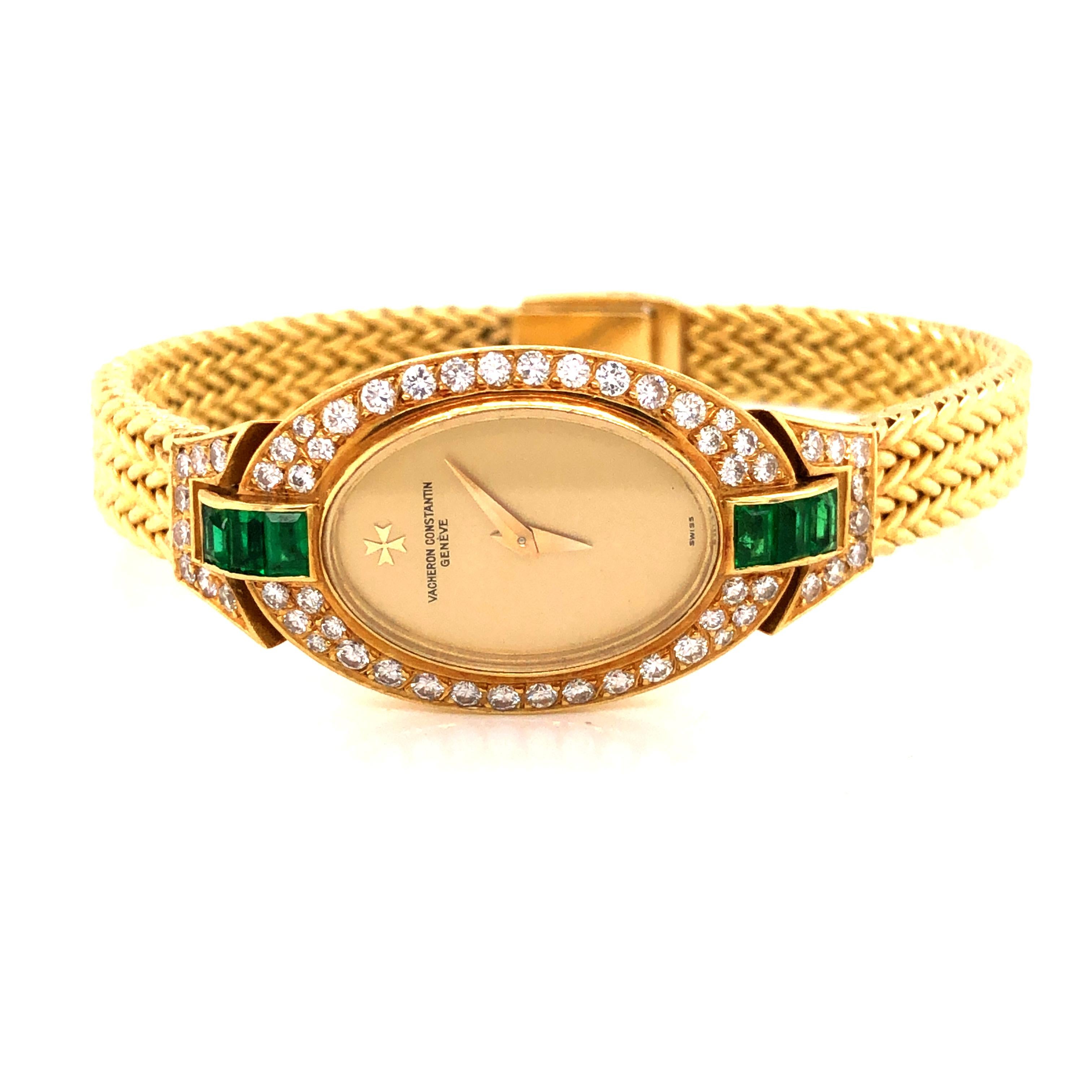 Beautiful vintage watch by Vacheron Constantine.  This timeless creation is crafted in 18k yellow gold. The watch is breathtaking as emerald and diamonds decorate the case. Watch is an oval design with a truly luxurious look. The watch measures 6.5