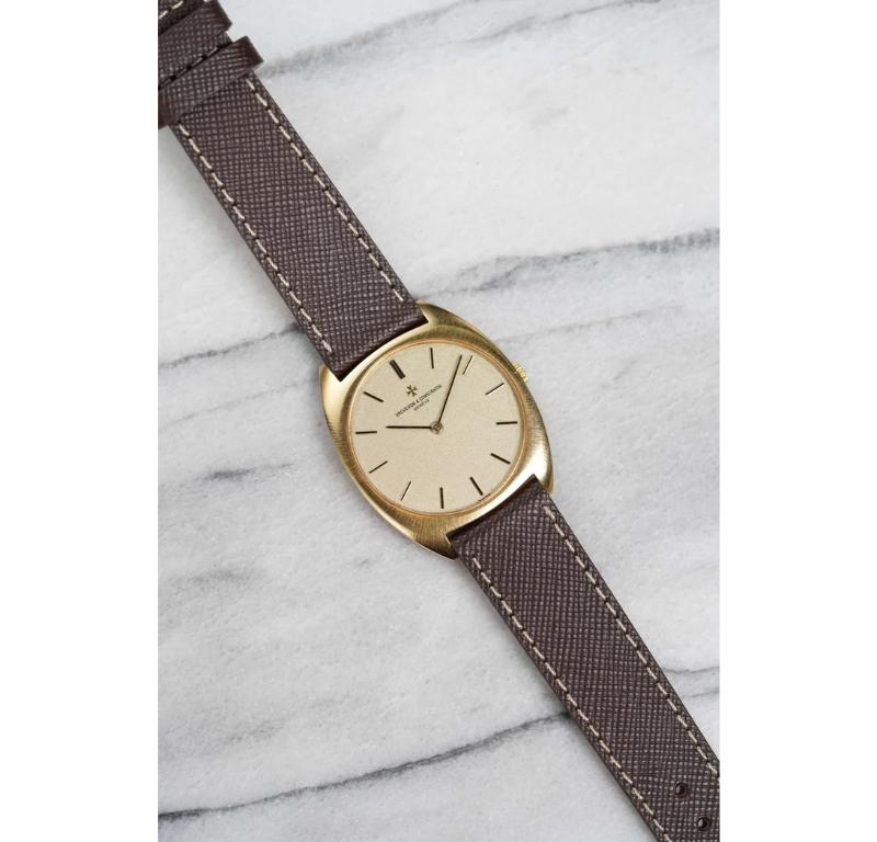 Here's a vintage Vacheron Constantin cushion case manual wind in 18K yellow gold with a champagne dial from the 1970s. Keeps great time and is fully functional. Measurements include a 35mm case size across and 18mm lug width. On an aftermarket brown