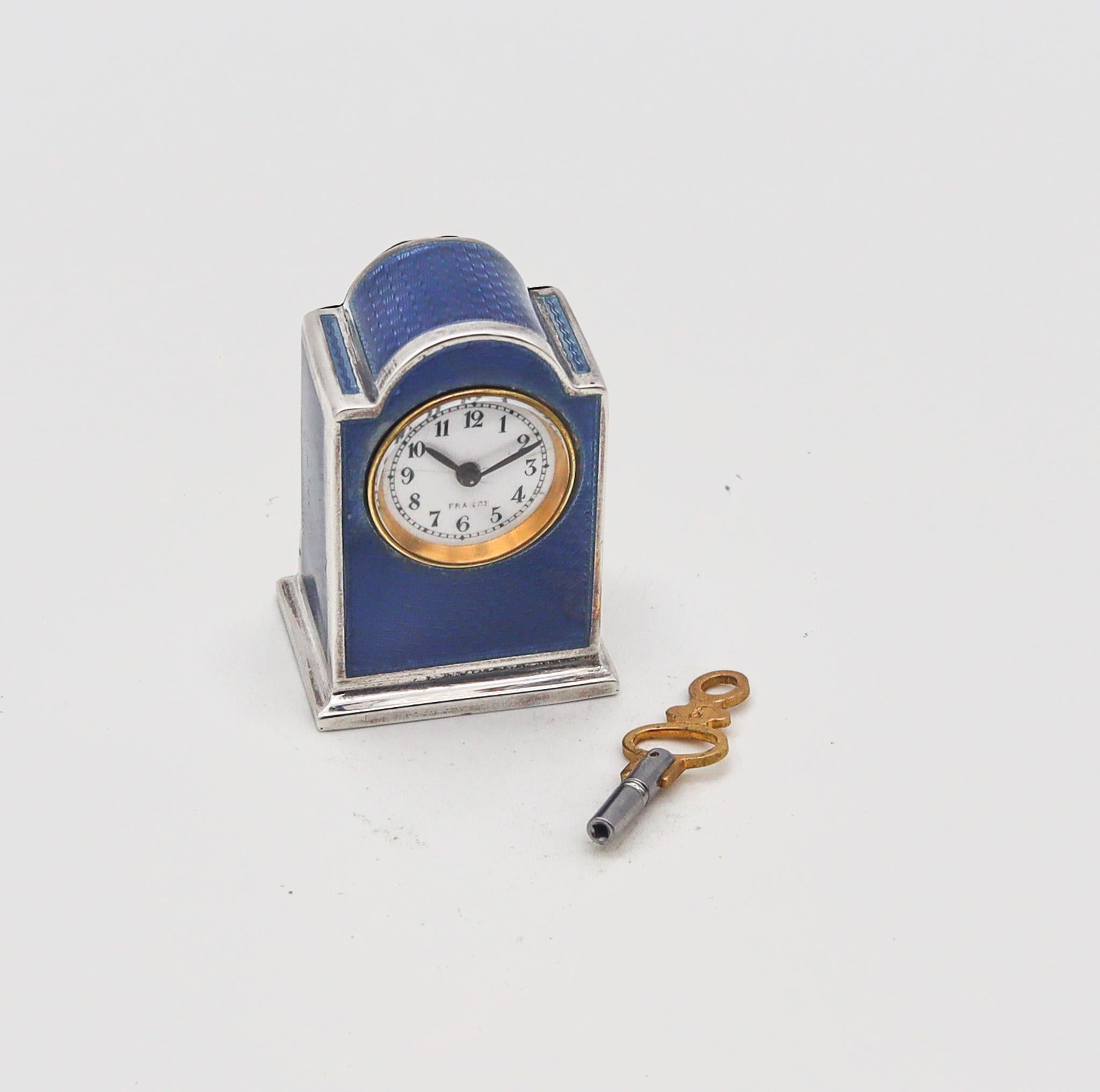 A miniature travel clock designed by R. Vachet Paris.

Exceptional and very rare miniature travel-carriage clock, made in Paris France at the atelier of R. Vachet. This fabulous little antique clock was crafted during the late Edwardian period, back