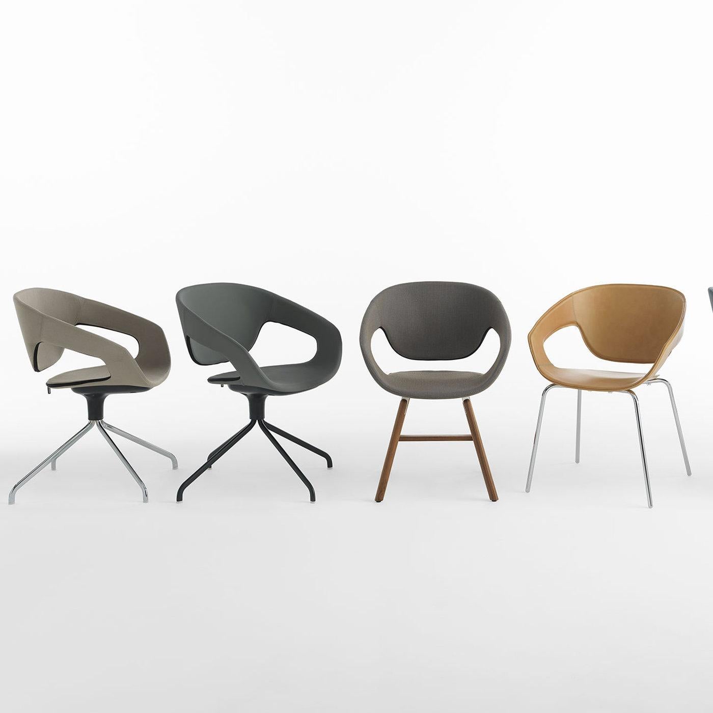 Sleek lines and curved edges are the defining features of this elegant chair of the Vad series designed by Luca Nichetto. The contoured silhouette and open backrest reflect the balanced simplicity of the Scandinavian style, which is the main