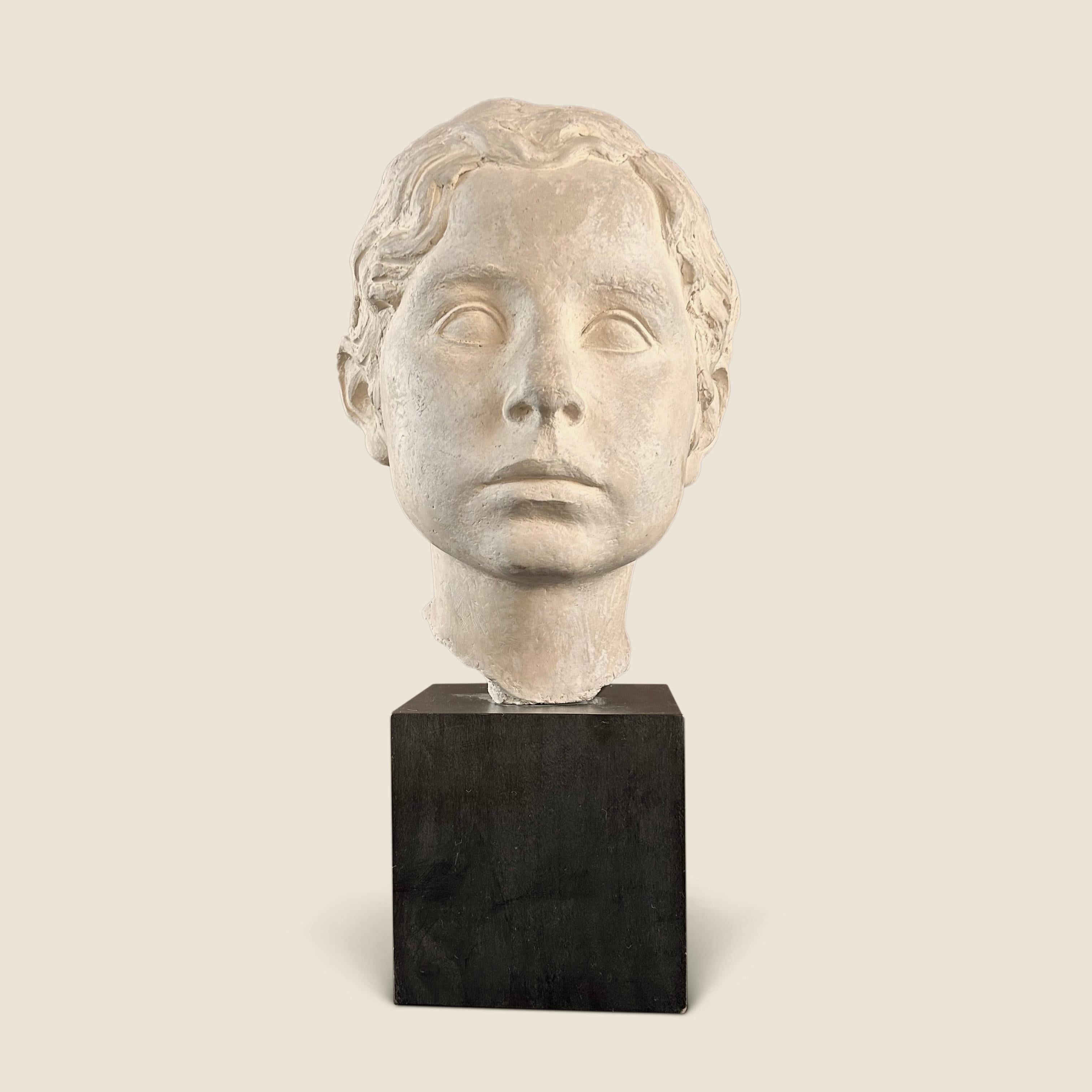 Vadim Androusov (1895-1975) Plaster head of a boy on a stained black wood plinth, signed and dated 3.9.47 
From an apartment in Toulouse decorated by Andre Arbus in the 1940s


