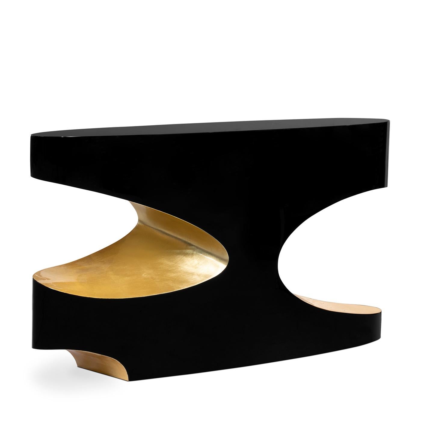 Table console Vadis avec structure en bois en 
finition laquée noire et finition feuille d'or.