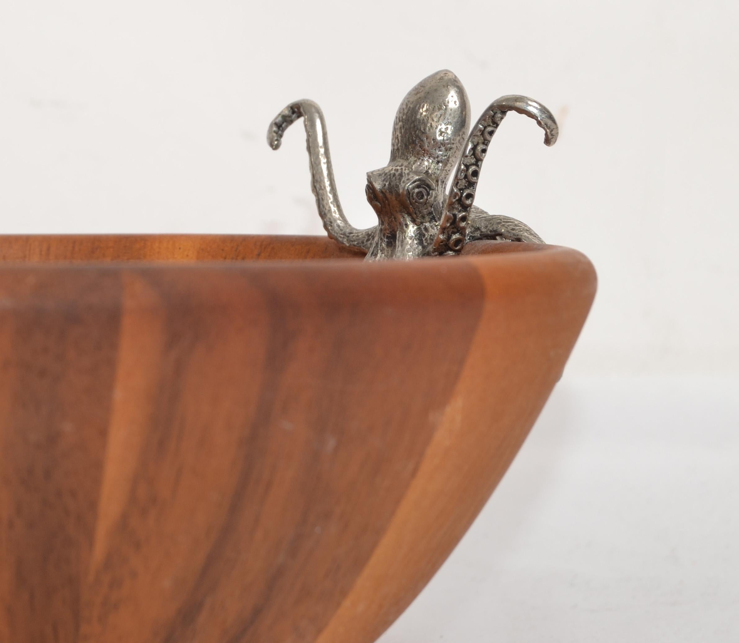 Ancient Egyptian mythology associated the Acacia tree with characteristics of the Tree of Life. Today, the wood from the Acacia tree is still treasured for its beauty and durability. Adorned with pewter sea life accents, our Acacia wood salad bowls