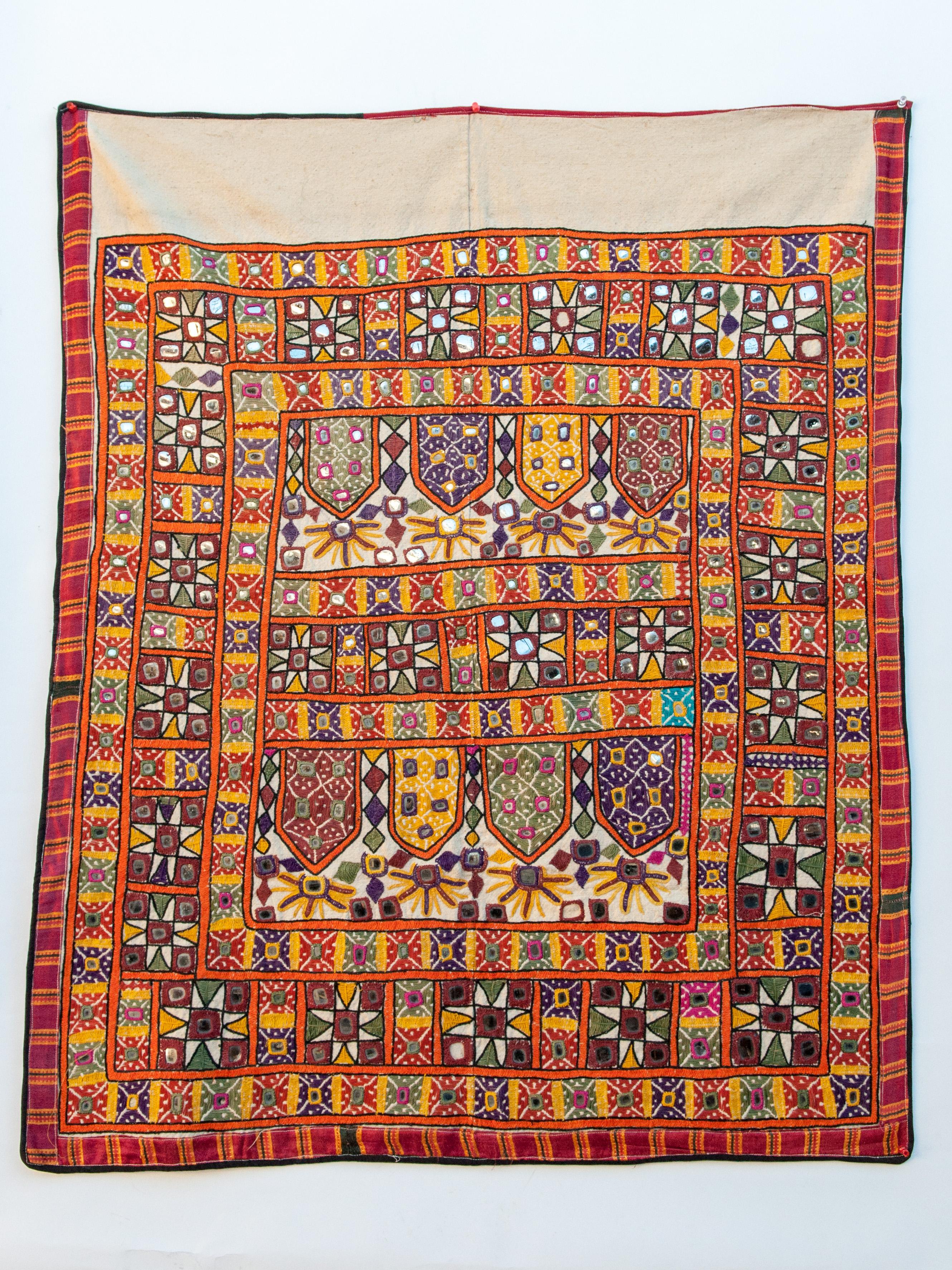 Vaghadia Rabari Dharaniyo textile hanging, mid-20th century.
This colorful textile comes from the Vaghadia Rabari, a ethnic group of pastoralists living in eastern Gujarat in India. This particular piece most likely comes from the area of Saurashtra