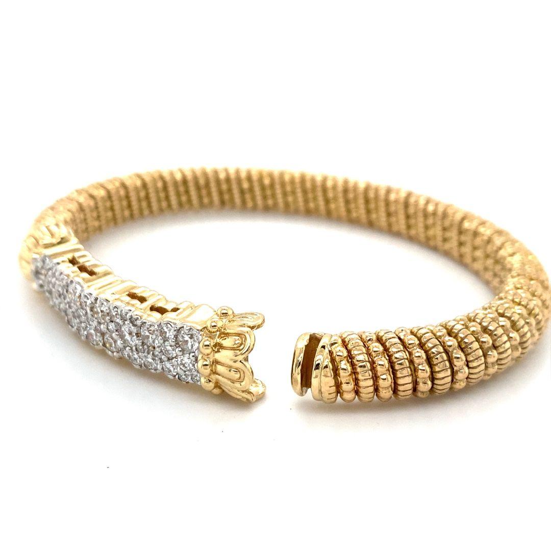 This is a stunning Alwand Vahan 14 karat gold bracelet with 1.81 total carat weight of diamonds, perfect for any occasion. The bracelet measure 7 inches with a hook style clasp. It has a width of 8mm. Don't miss out on this unique piece, make it