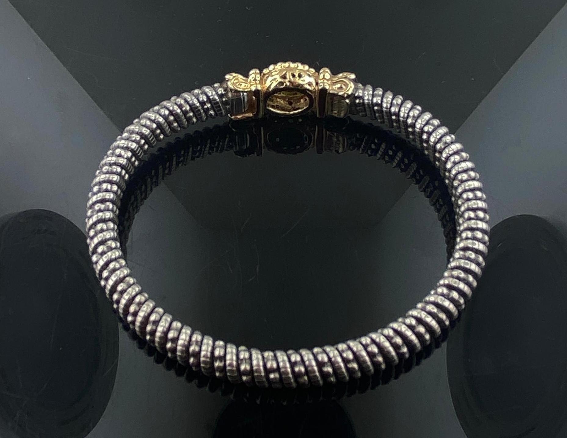 Vintage, Alwand Vahan 14 carats or jaune avec bracelet en argent sterling. Le centre du fermoir contient un péridot pesant environ 2,50 carats. Le bracelet mesure environ 7 pouces et se ferme par un crochet.