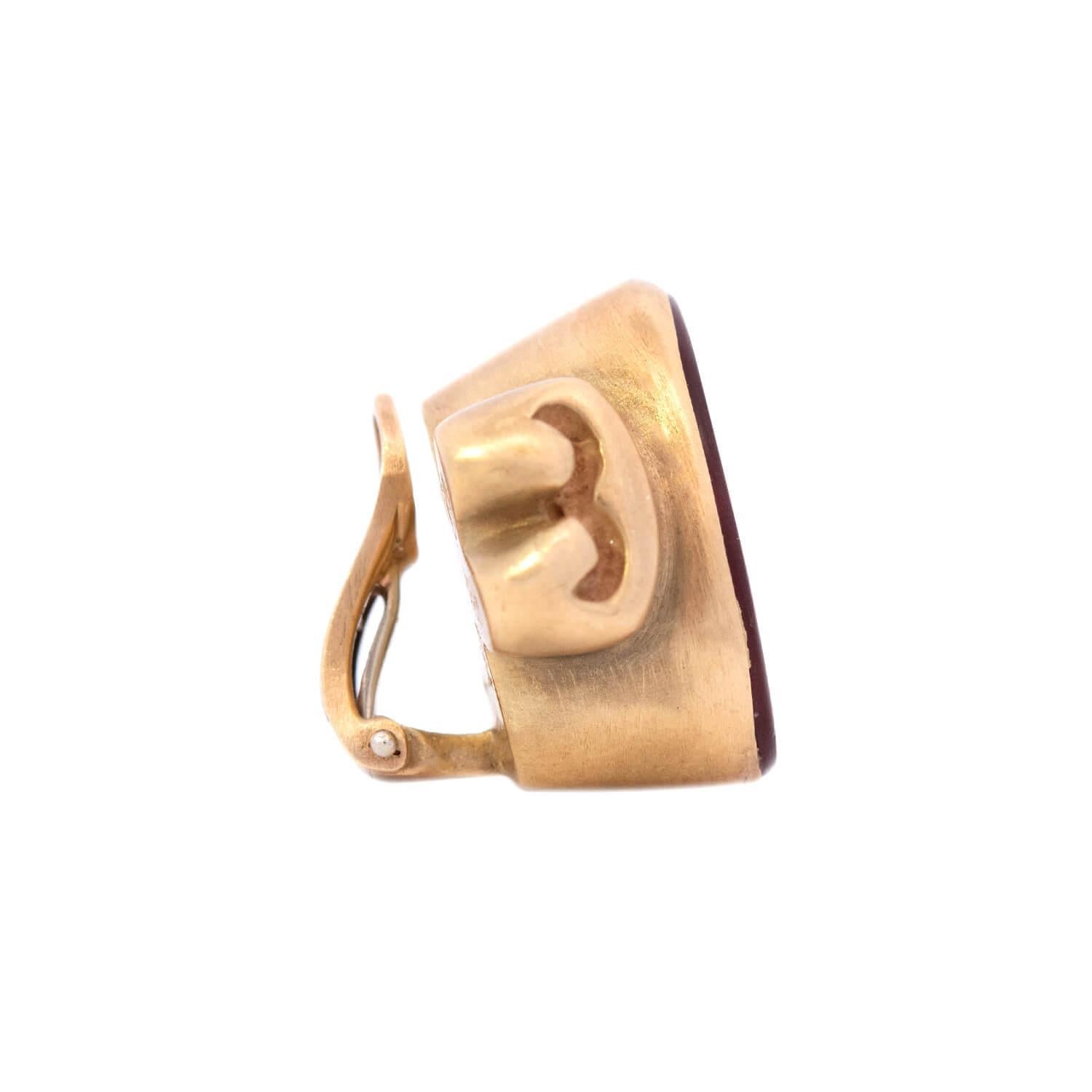 A beautiful pair of Estate earrings from designer Vahe Naltchayan! Crafted in 18k yellow gold, each earring features a bezel set carnelian intaglio. The oval-shaped carnelian stones depict the likeness of the Roman god of war, Mars. The intaglios