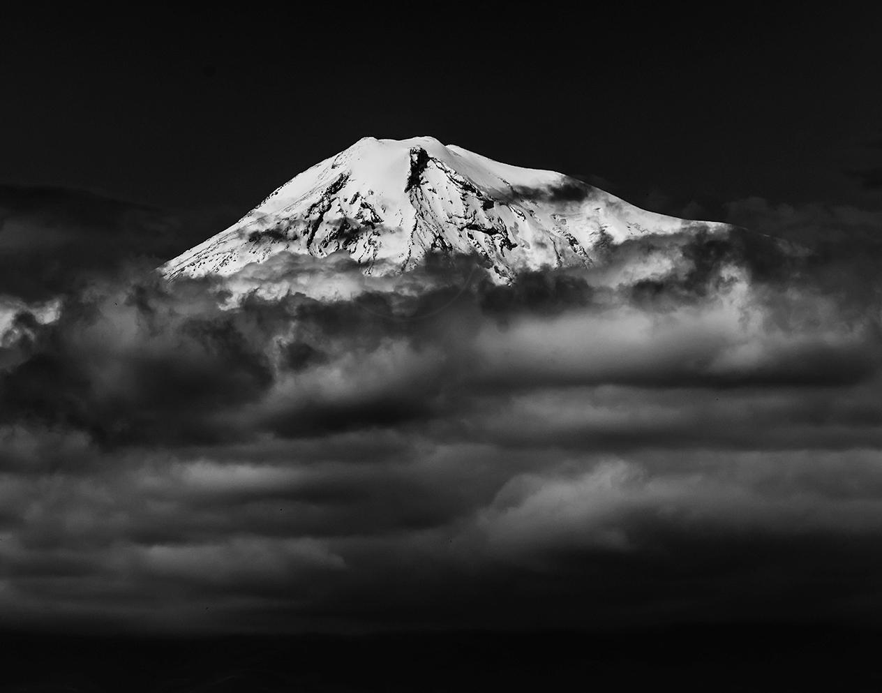 The summit of Mt. Ararat, the ancient symbol of everything Armenian, peeks above the clouds that had enshrouded it from view, if only momentarily... 

Edition 1 of 5. Photograph printed on canvas, signed by artist lower right. 

Vahé Peroomian is a