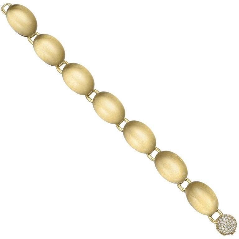 Domed link bracelet, featuring cabochon-cut oval rock crystals set over satin-finished 18k yellow gold, secured by a pave-set round-cut diamond clasp.

Stamped 'VAID ROMA'
56 round brilliant-cut diamonds weighing ~1.12 total carats (G-color, VS1-VS2