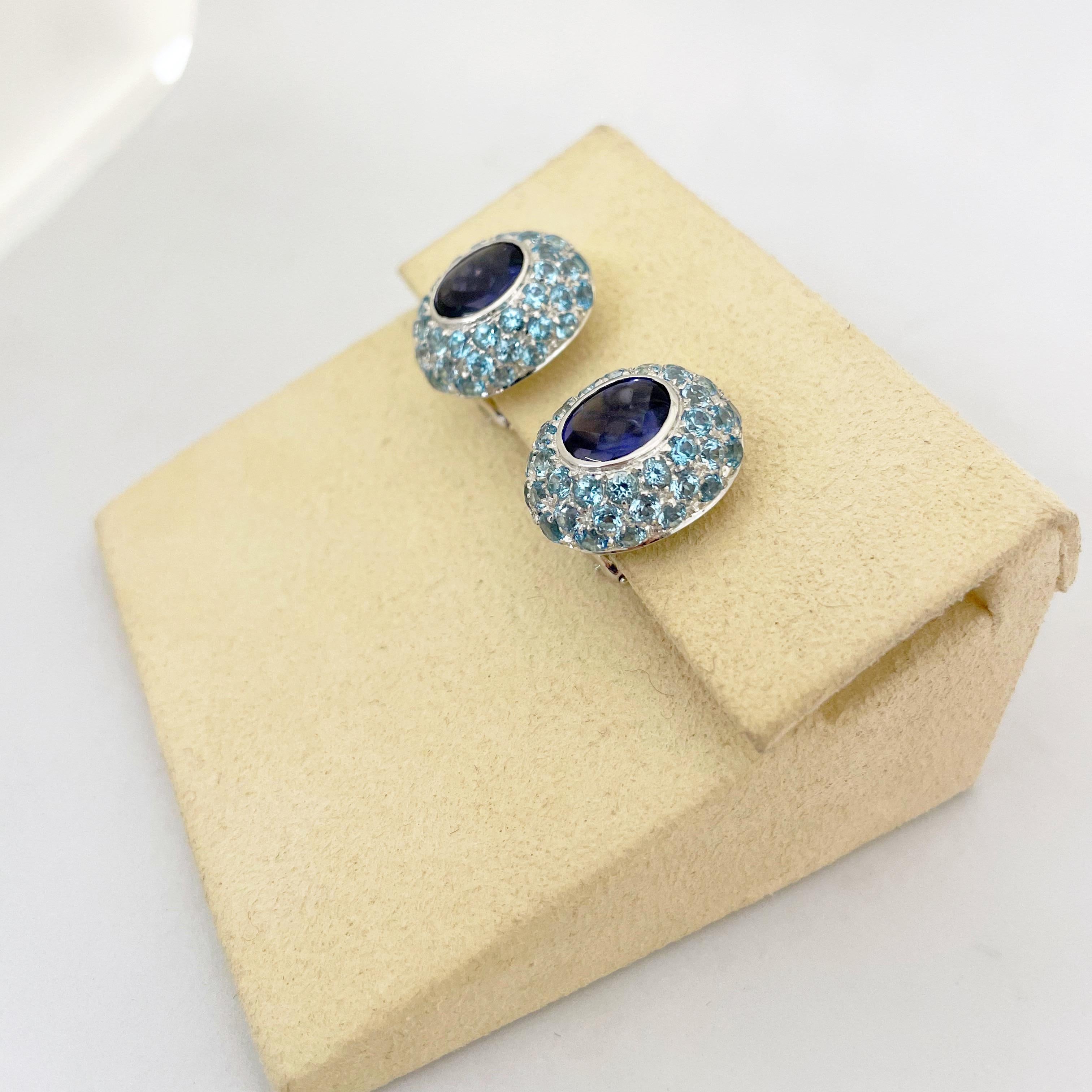 Italian Jewelers for more than three generations, VAID has produced merchandise exclusively for some of the most renowned jewelers across the world. These  VAID 18 KT white gold  button earrings are designed with oval  iolite centers surrounded by 