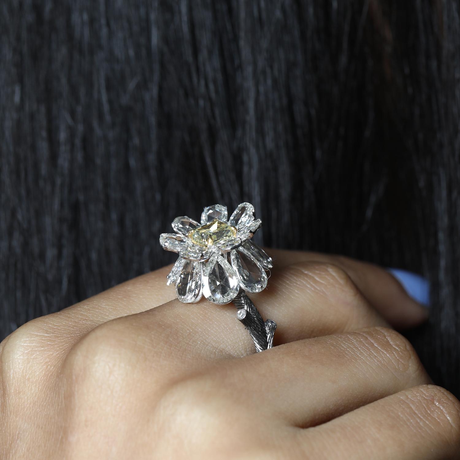 This 3 dimensional ring is inspired  from nature and is made with  V.A.K. Jewellery's signature engineering which uses minimal metal.
The rose cut diamonds are set to look  like floating petals . The design is bespoke , limited to just 1 piece in