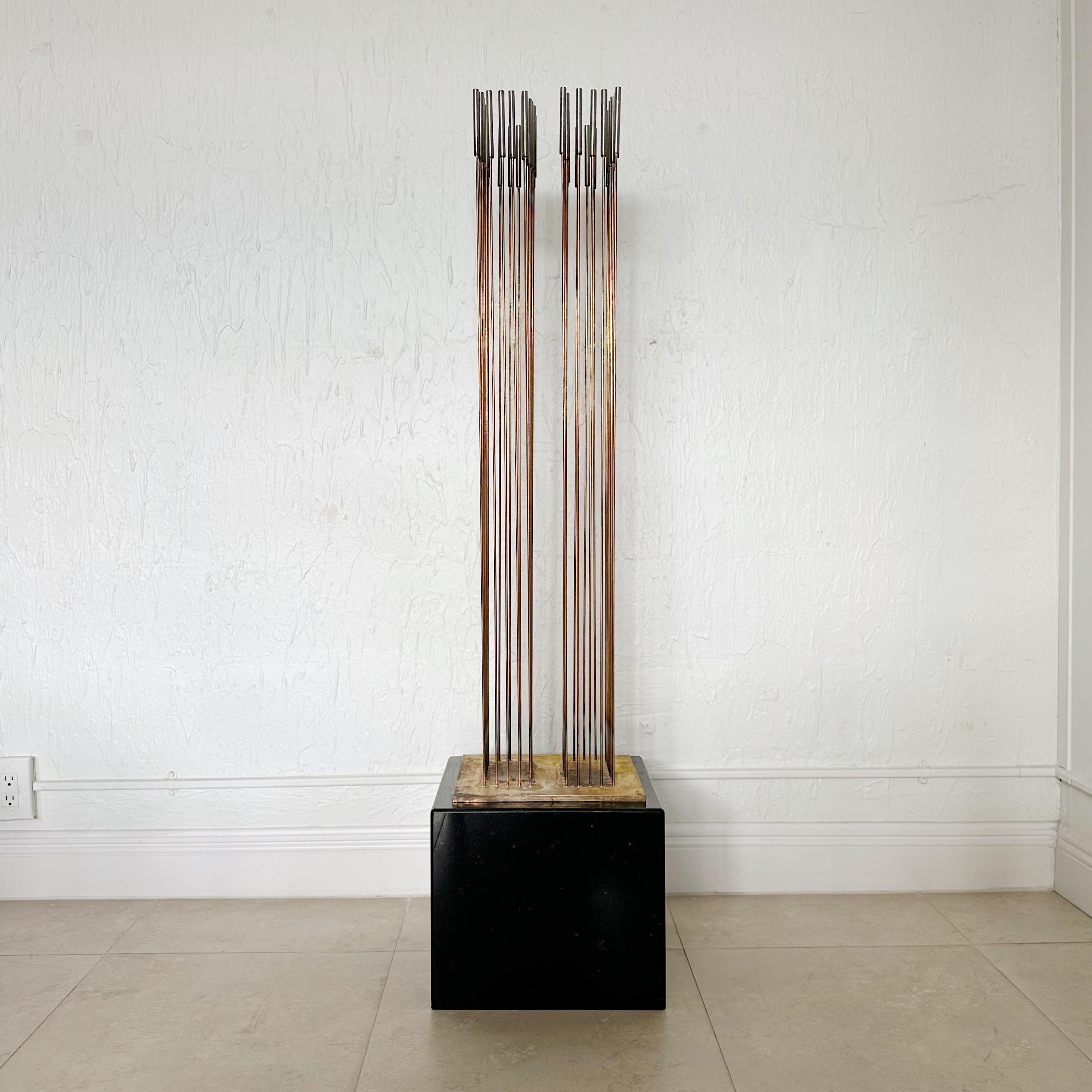 Sounding sculpture by Val Bertoia, American (born 1949). Titled 2 alphabets per year of sound. Comprised of 26 + 26 