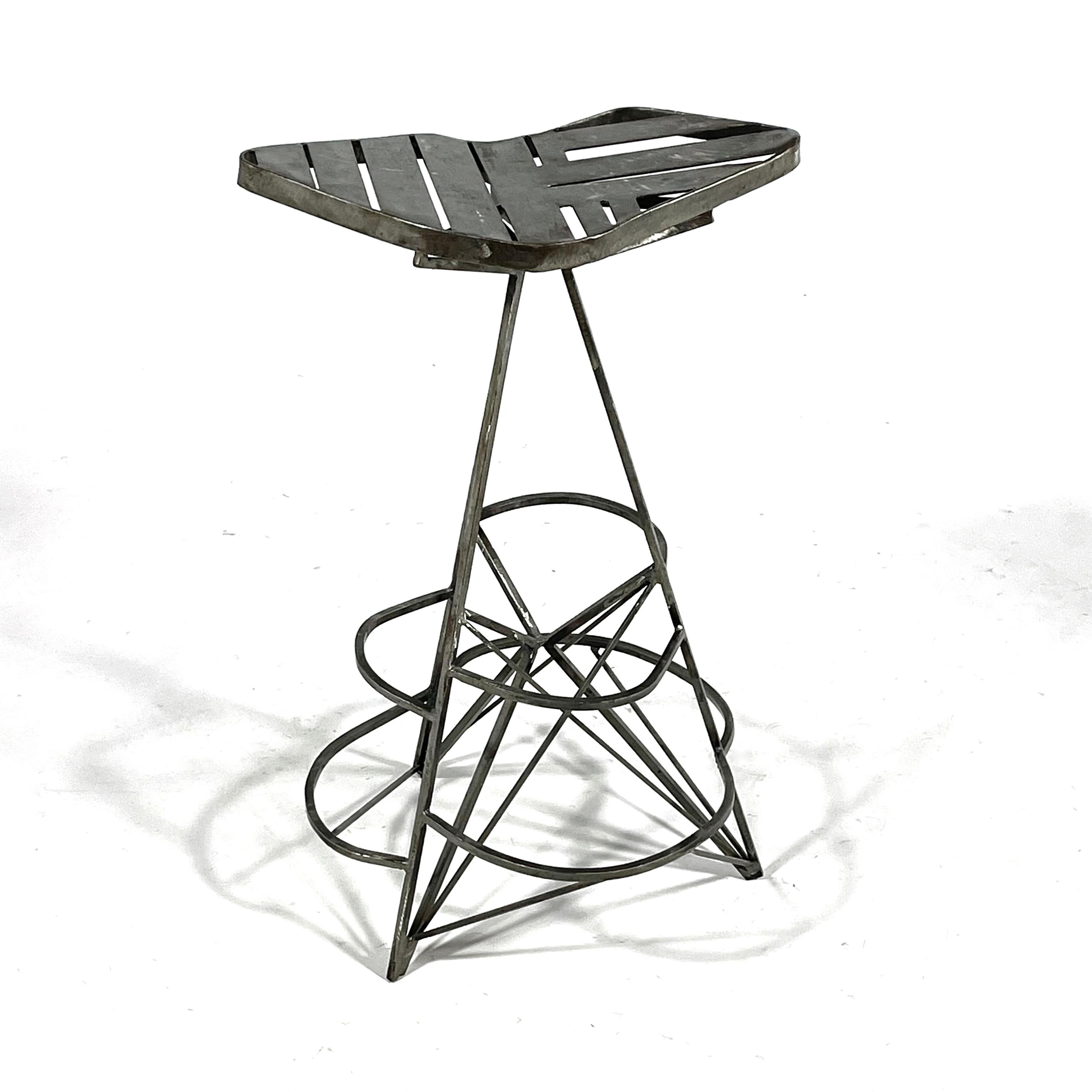 Equal parts sculpture and functional object, this stool by Branford, CT artist Val Kropiwnicki shows his use of positive and negative space in a compelling way to create a three-legged perch. Kropiwnicki is known for creating works as large as