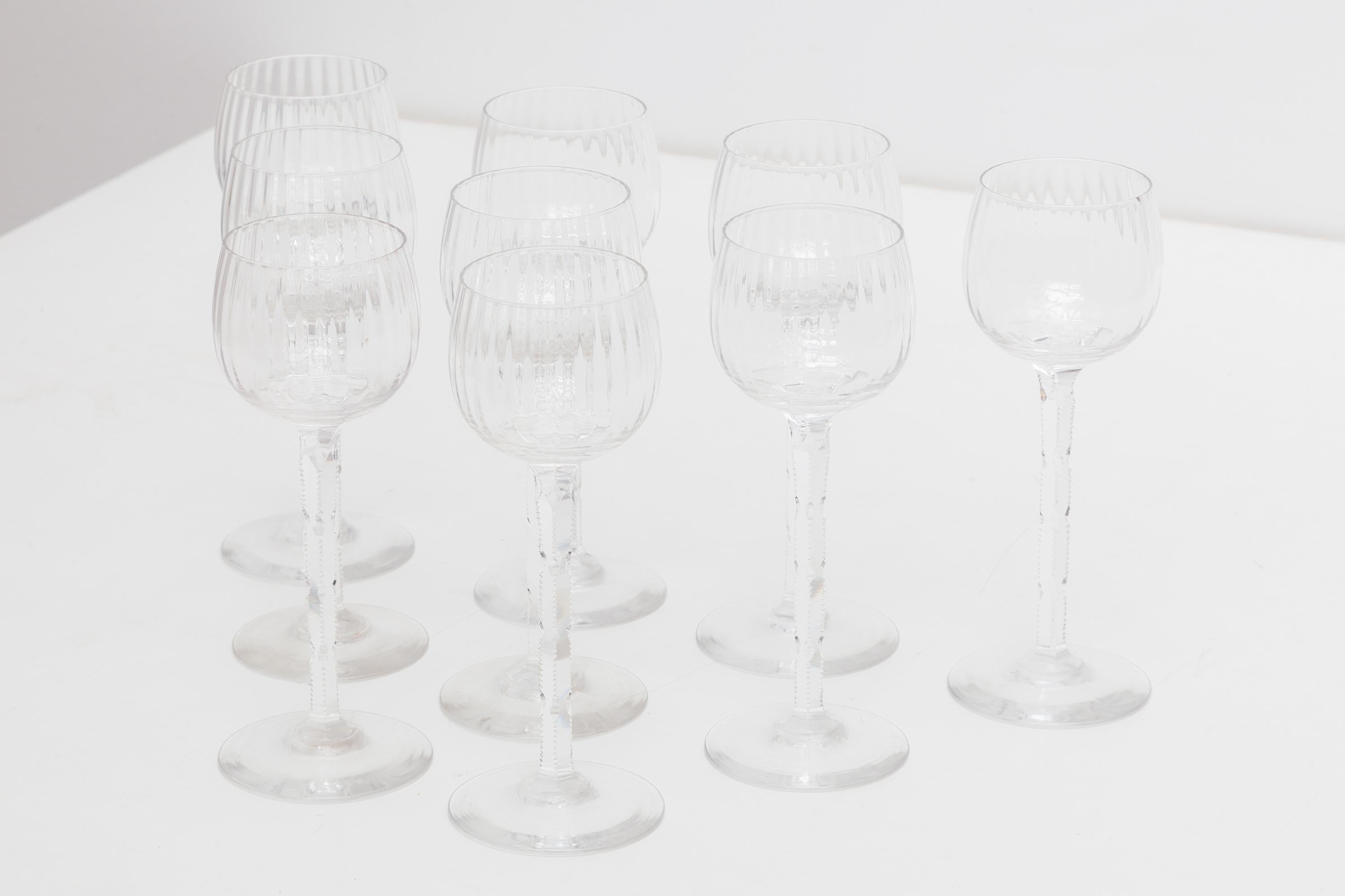 Vintage mid-century set of crystal glassware. Long stem with hand cut design. Dimensions: 7 W x 19 H cm.