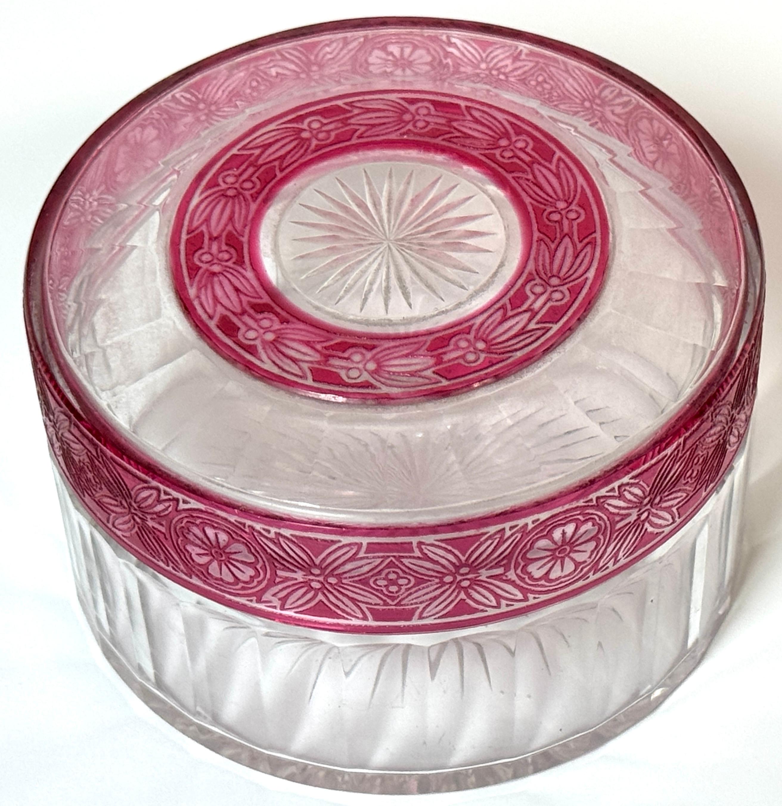 Val Saint Lambert (Attrib.) Red Floral Cut-to-Clear Crystal Table Box

A richly detailed cut-to-clear crystal table box is attributed to Val Saint Lambert, Belgium, circa 1920. This round lidded box features a thick, clear lead crystal body with