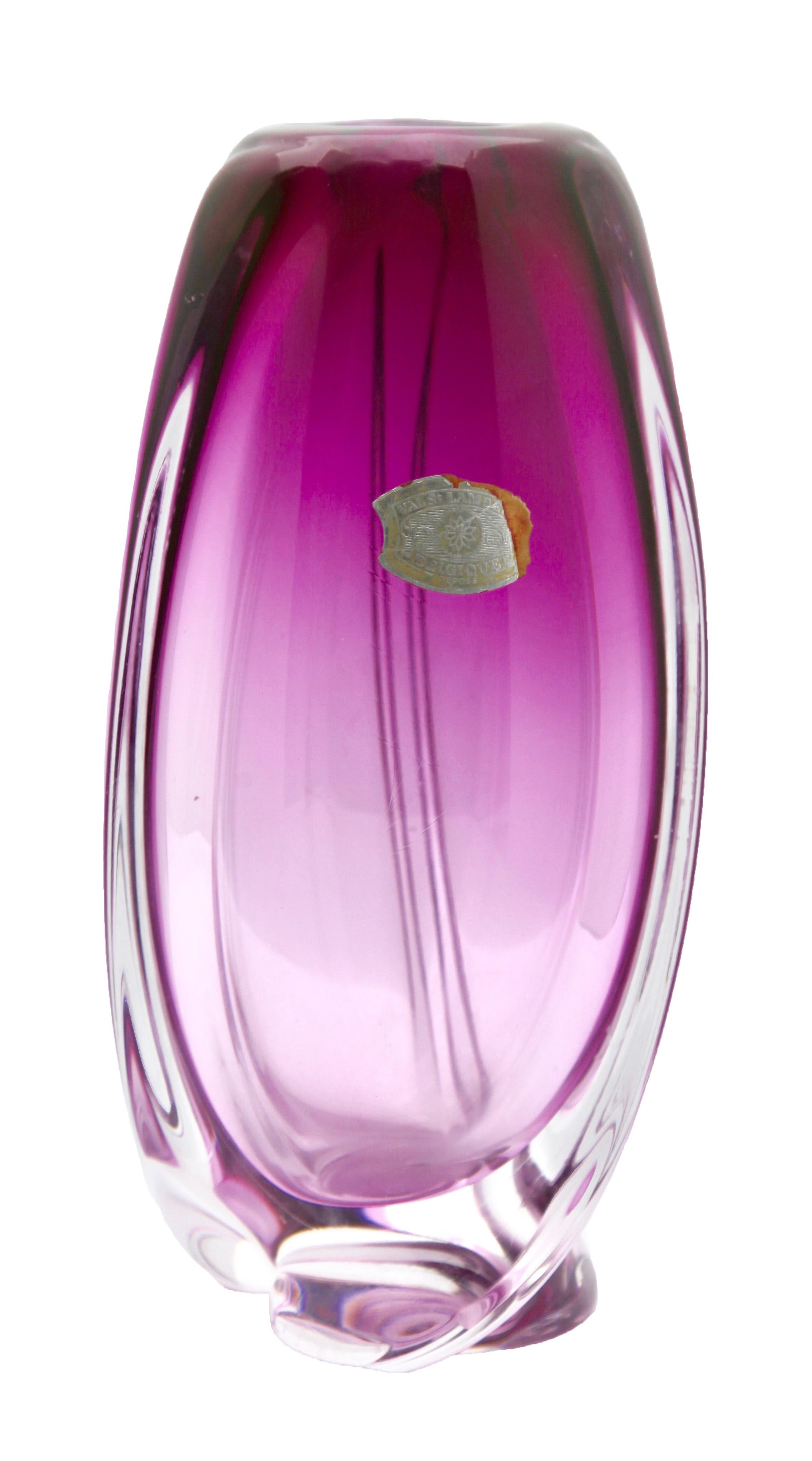 Heavy Val Saint Lambert crystal vase with label, catalogued in the 1950s.
The central amethyst colour (a traditional favorite for VSL) has been given a thick Sommerso (clear layer on the outside) and sculpted with subtle curves by the master