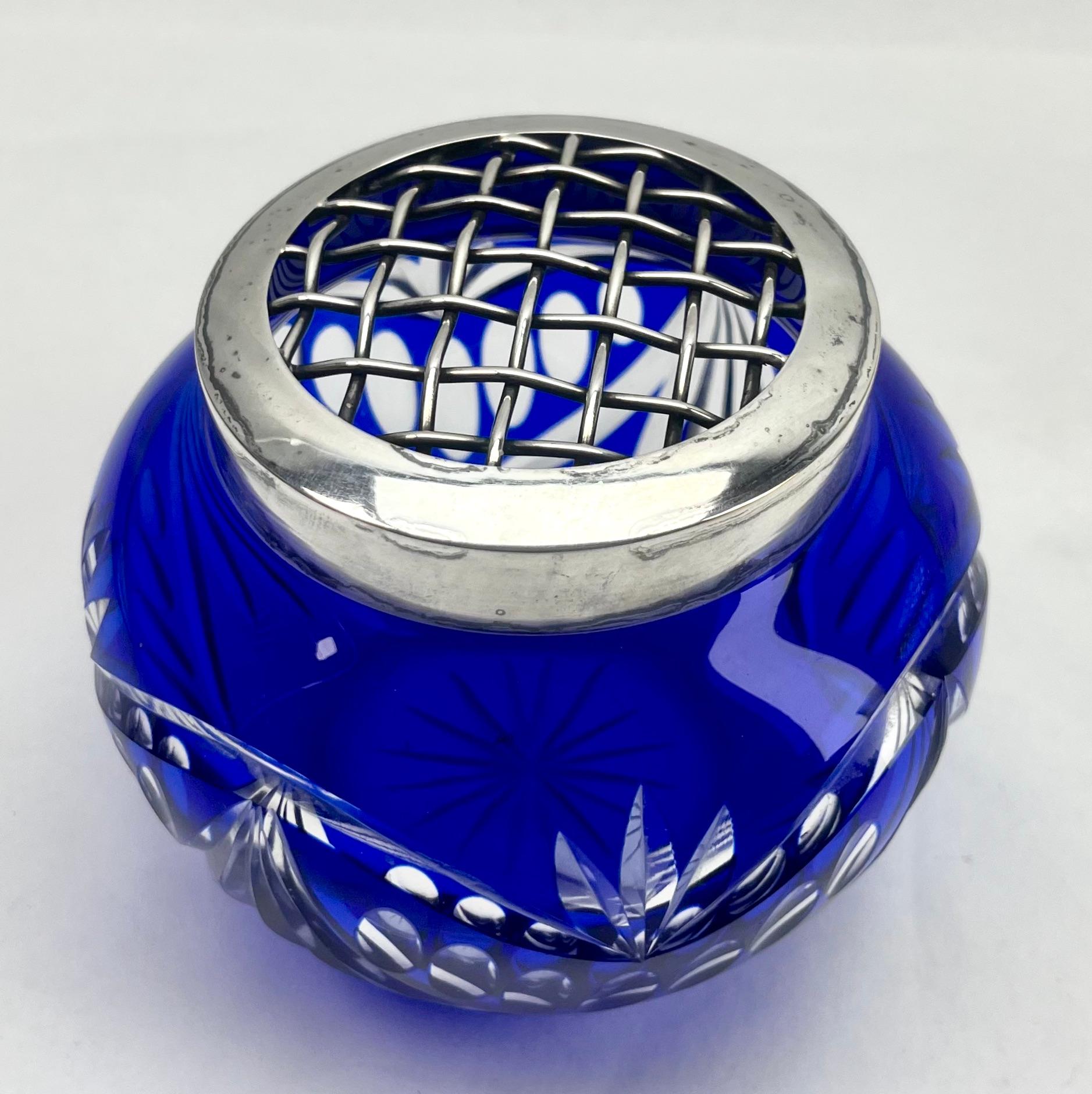 Vibrant Cobalt, cased-crystal glass large 'Pique Fleurs' vase with a cut-to-clear Art Deco decoration 
This design for vases is often called 'Pique fleurs' or 'rose-bowl' and is supplied with a fitted crystal grille to support stems in an