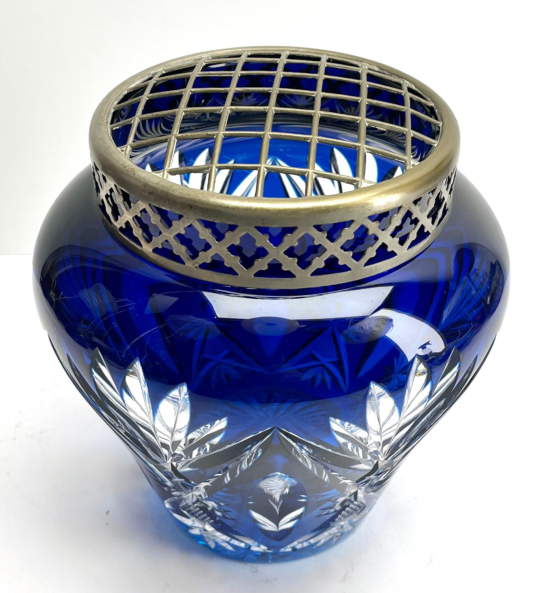 Vibrant Cobalt, cased-crystal glass large 'Pique Fleurs' vase with a cut-to-clear Art Deco decoration 
This design for vases is often called 'Pique fleurs' or 'rose-bowl' and is supplied with a fitted crystal grille to support stems in an
