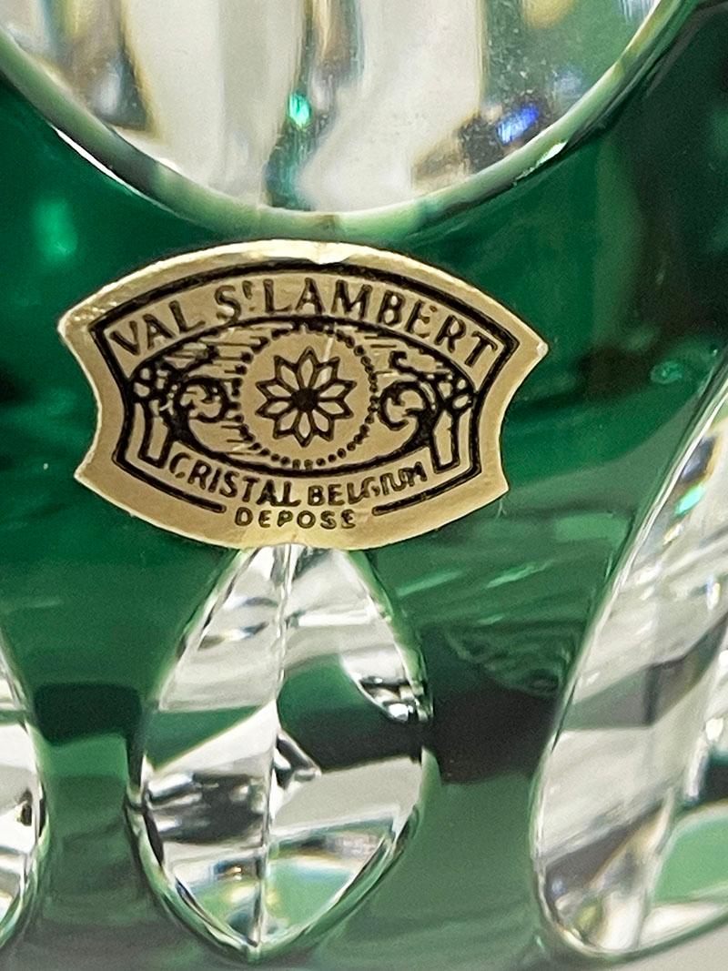 Val Saint Lambert green cut-to clear Crystal ashtray, Signed

A small Belgium green colored cut to clear crystal ashtray from Val Saint Lambert, Belgium, established since 1826. 
The ashtray is signed on the bottom and the has the golden paper