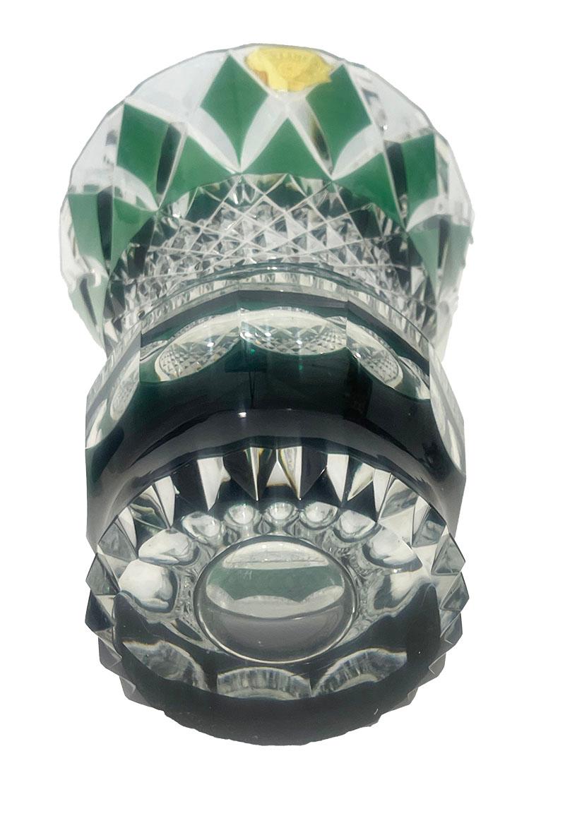 Val Saint Lambert green cut-to clear crystal vase, Signed

A  Belgium green colored cut to clear crystal vase from Val Saint Lambert, Belgium, established since 1826. 
The vase is signed on the bottom and the vase has the golden paper label. 

The