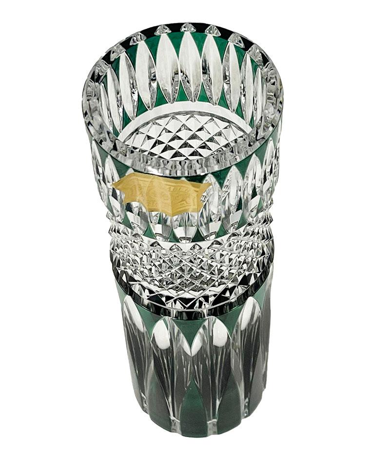 Val Saint Lambert green cut-to clear small Crystal vases, Signed

A Belgium green colored cut to clear crystal vase from Val Saint Lambert, Belgium, established since 1826. 
The vase is signed on the bottom and the vase has the golden paper label.