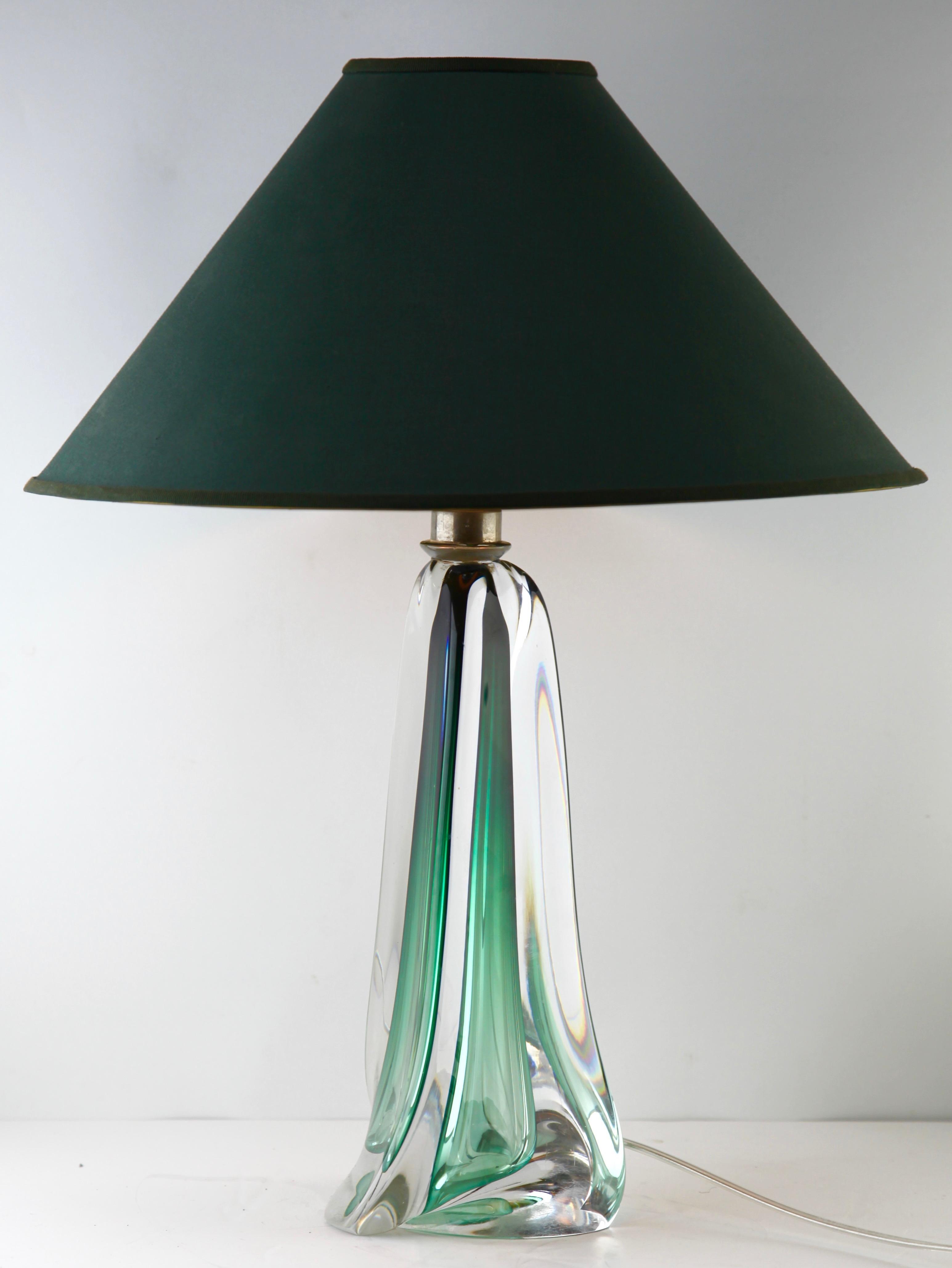 This simple yet graceful table lamp is in large size, 14.56 inches excluding the shade.
The core in Classic Val Saint Lambert has been given a thick Sommerso (clear crystal casing) so that the object appears delicate whilst remaining solid and