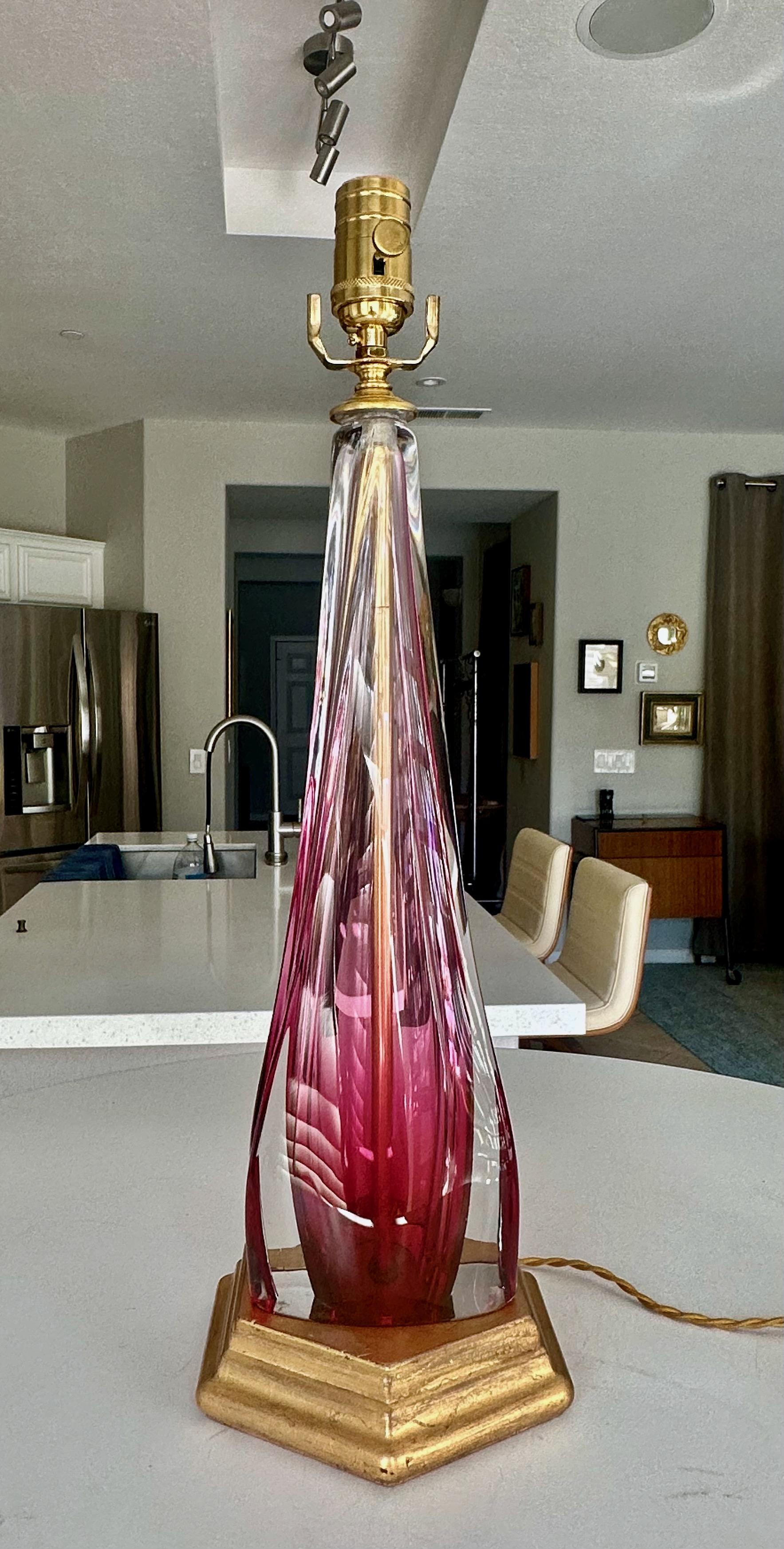 Single Val Saint Lambert crystal ruby red and clear oval shape talbe lamp. Mounted on giltwood base. Signed (engraved) under the bottom. Newly wired for US with new brass 3-way socket and cord. Measures: Glass portion 15.5