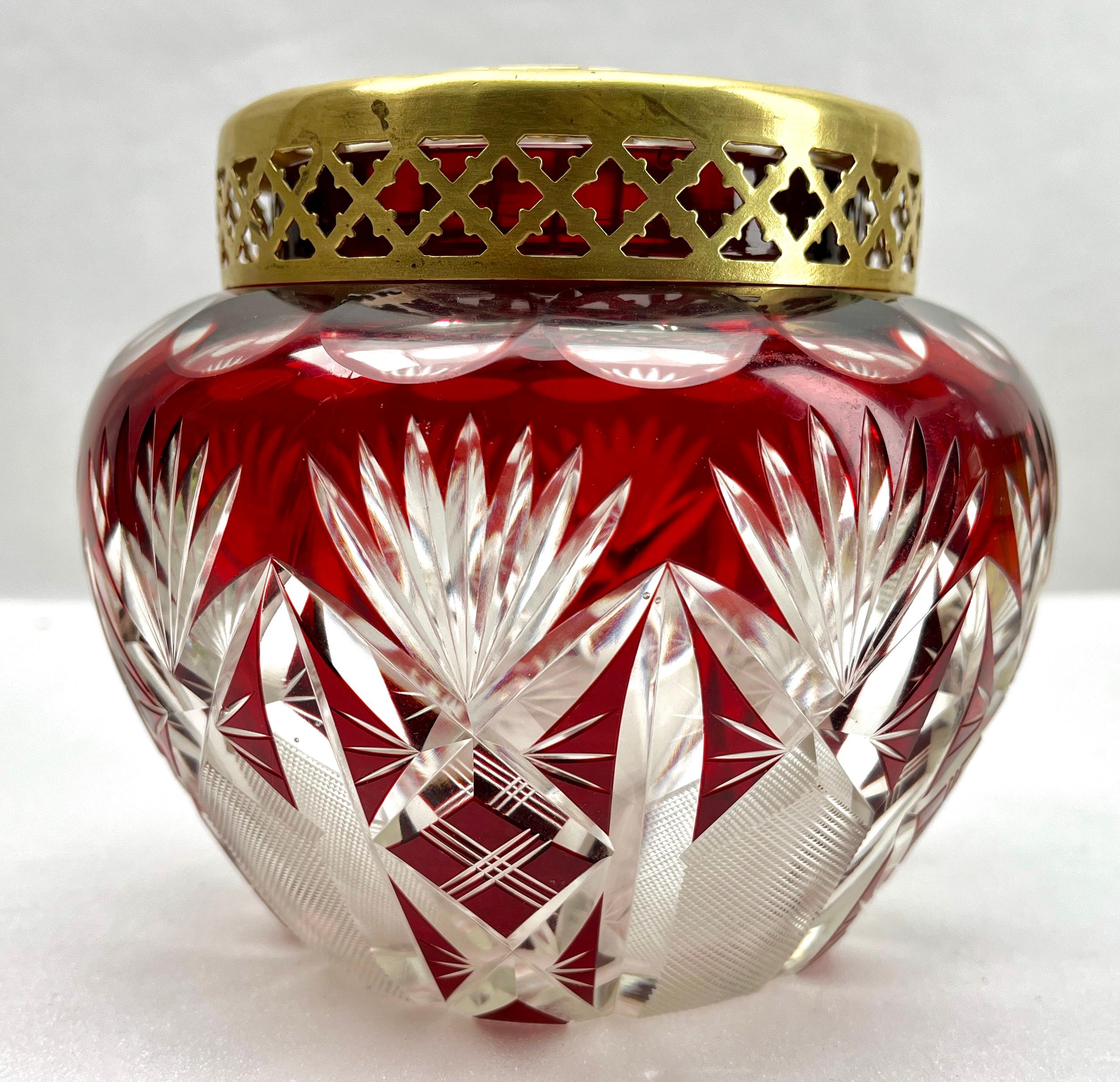 Vibrant, cased-crystal glass large 'Pique Fleurs' vase with a cut-to-clear Art Deco decoration 
This design for vases is often called 'Pique fleurs' or 'rose-bowl' and is supplied with a fitted crystal grille to support stems in an arrangement. The