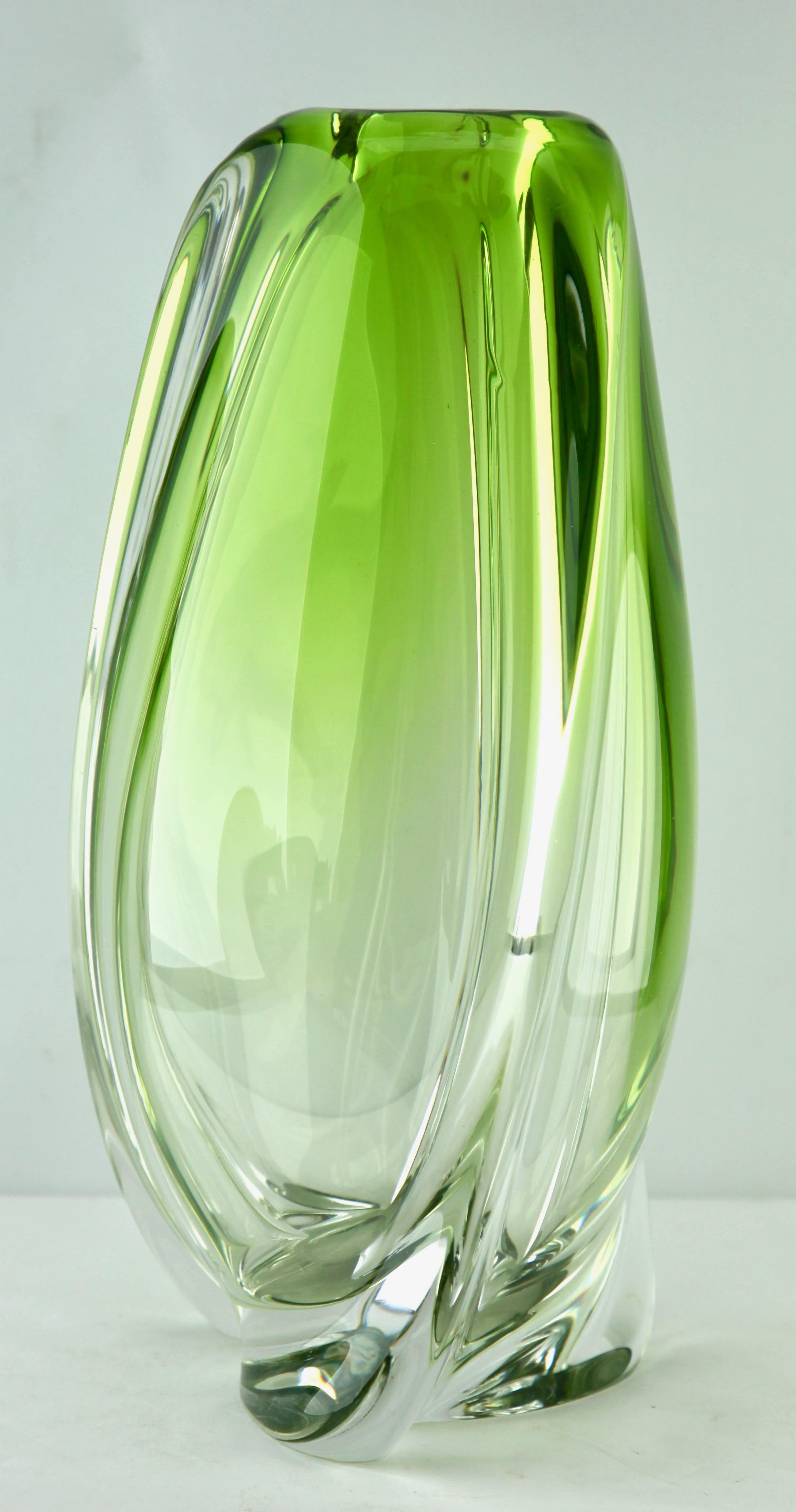 Heavy Val Saint Lambert crystal vase signed, catalogued in the 1950s.
The central Green color (a traditional favorite for VSL) has been given a thick Sommerso (clear layer on the outside) and sculpted with subtle curves by the master craftsmen at