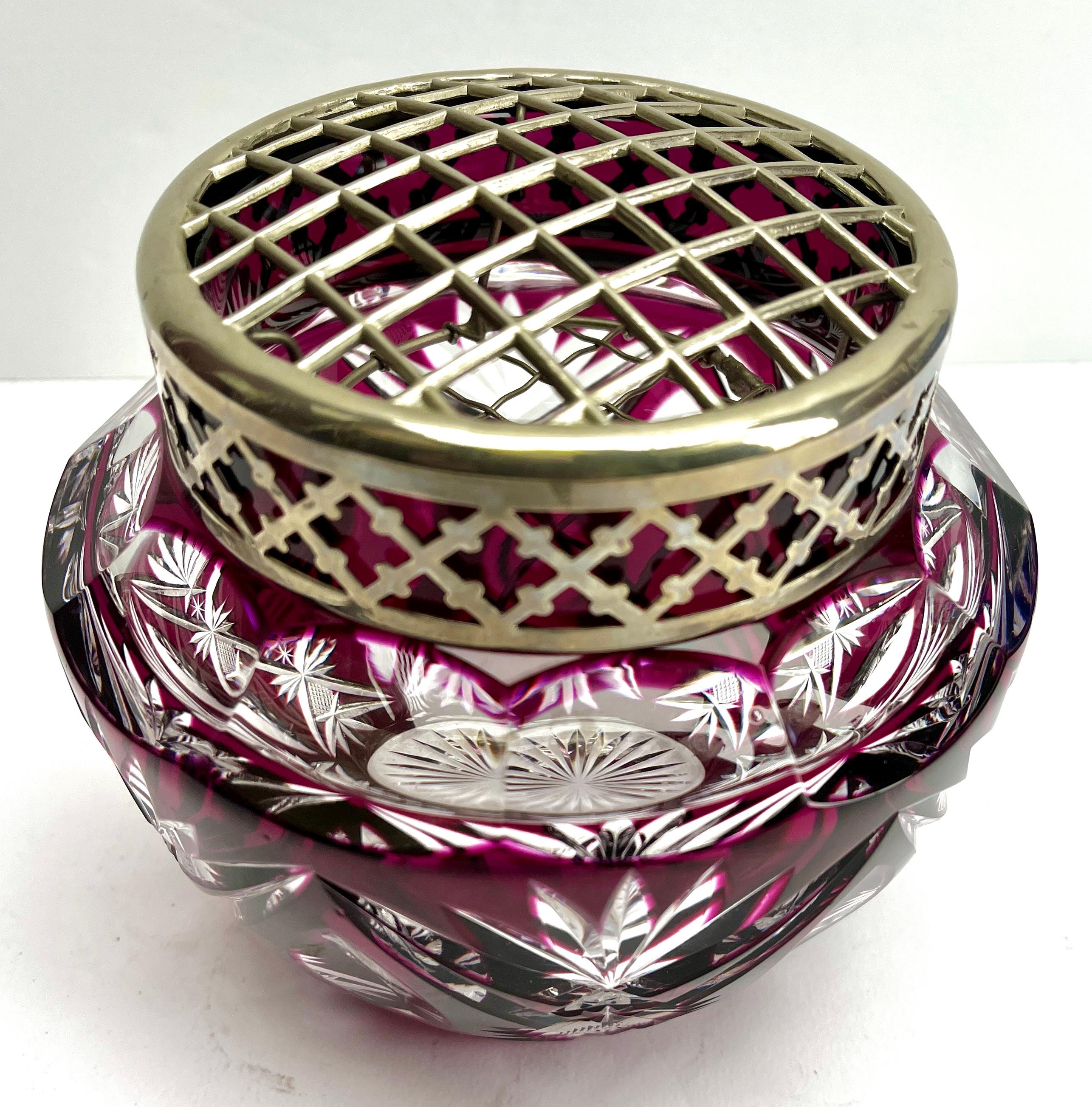 Vibrant  cased-crystal glass large 'Pique Fleurs' vase with a cut-to-clear Art Deco decoration 
This design for vases is often called 'Pique fleurs' or 'rose-bowl' and is supplied with a fitted crystal grille to support stems in an arrangement. The