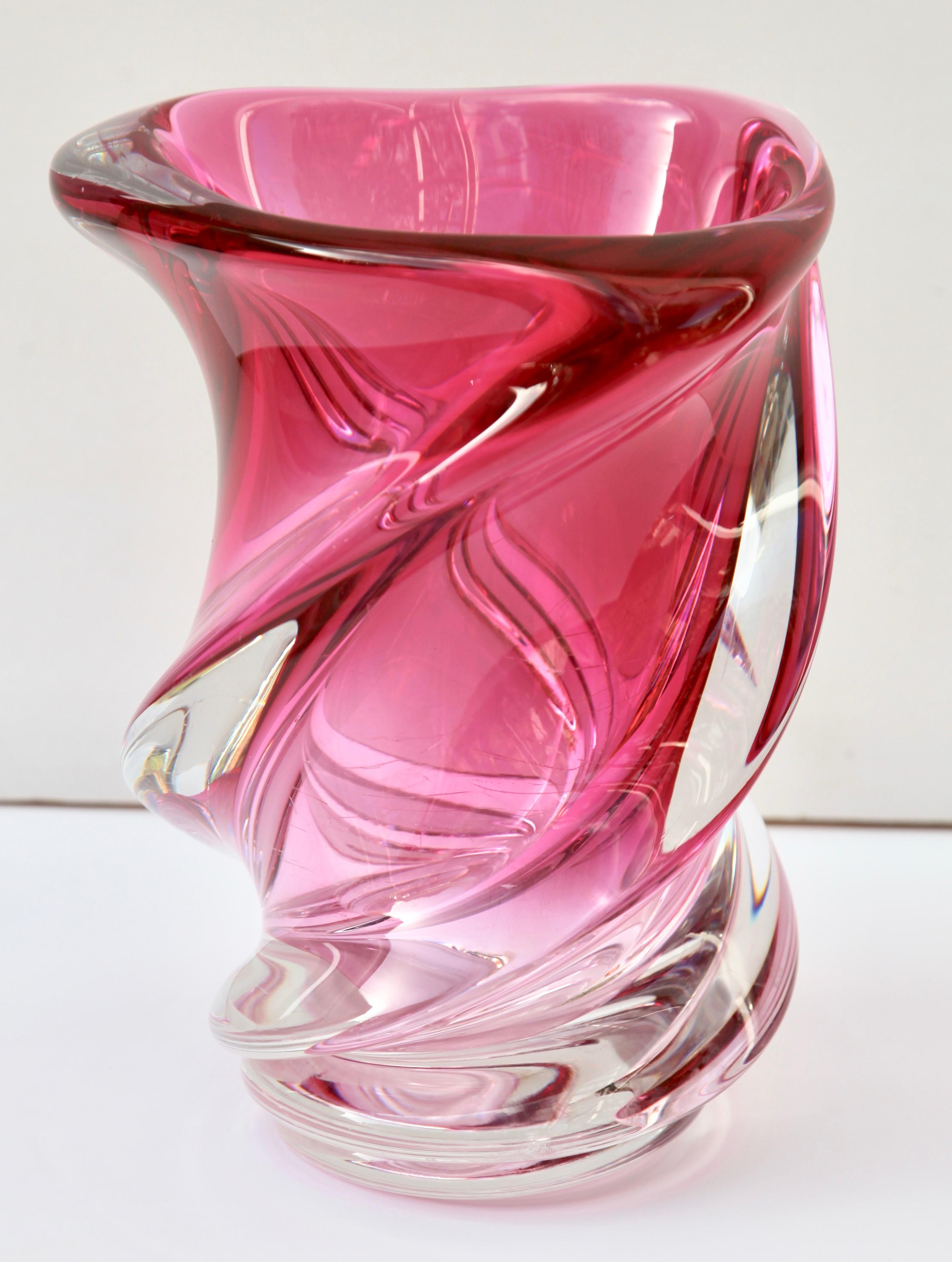 Heavy Val Saint Lambert crystal vase signed, catalogued in the 1950s.
The central amethyst color (a traditional favorite for VSL) has been given a thick Sommerso (clear layer on the outside) and sculpted with subtle curves by the master craftsmen