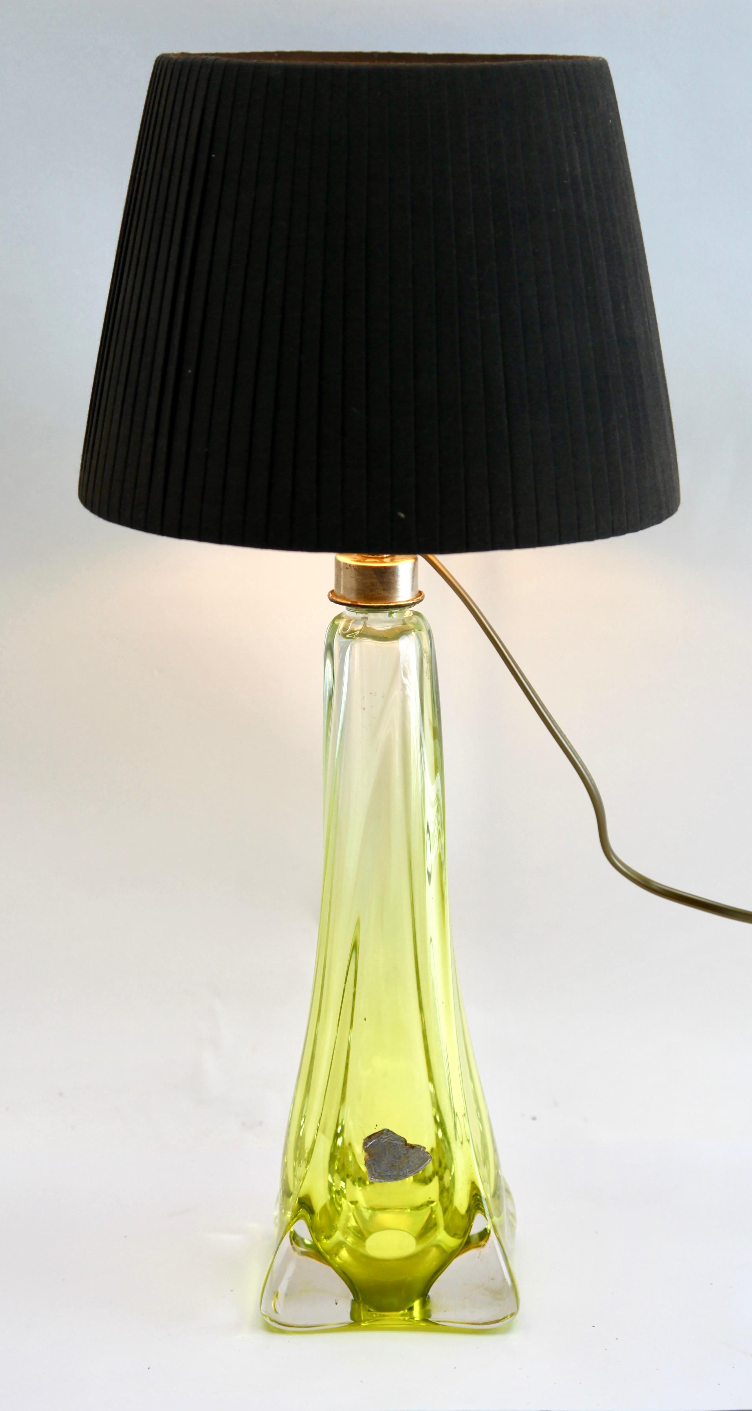 This simple yet graceful table lamp is in large size; 15 inches excluding the lamp-fitting and shade.
The colored core in Classic Val Saint Lambert tint, has been given a thick Sommerso (clear crystal casing) so that the object appears delicate
